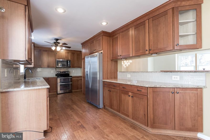 THIS HOME IS A MUST SEE! Perfect home for large family and/or entertaining. This home boasts of LOTS of living and outdoor space. There are FOUR bedrooms, THREE full bathrooms, and three BONUS rooms!! The kitchen has been fully remodeled with updated stainless steel appliances. Other living amenities include two large  family rooms, separate dining space, fireplace, and jacuzzi tub. The master bedroom has a custom-made walk-in closet inside of the sitting area. Enjoy quick access to the top floor with staircase leading from the master sitting area to one of the bonus rooms which connects to the garage. Lots of sunshine and multiple backyard accesses leading to large deck and enclosed gazebo. In addition to the deck and gazebo, note loads of storage space in the yard. This home is a neighborhood one of a kind, fun, and ready for your imagination and special touch!  With a wide driveway, there is plenty of parking in this cul-de-sac home.