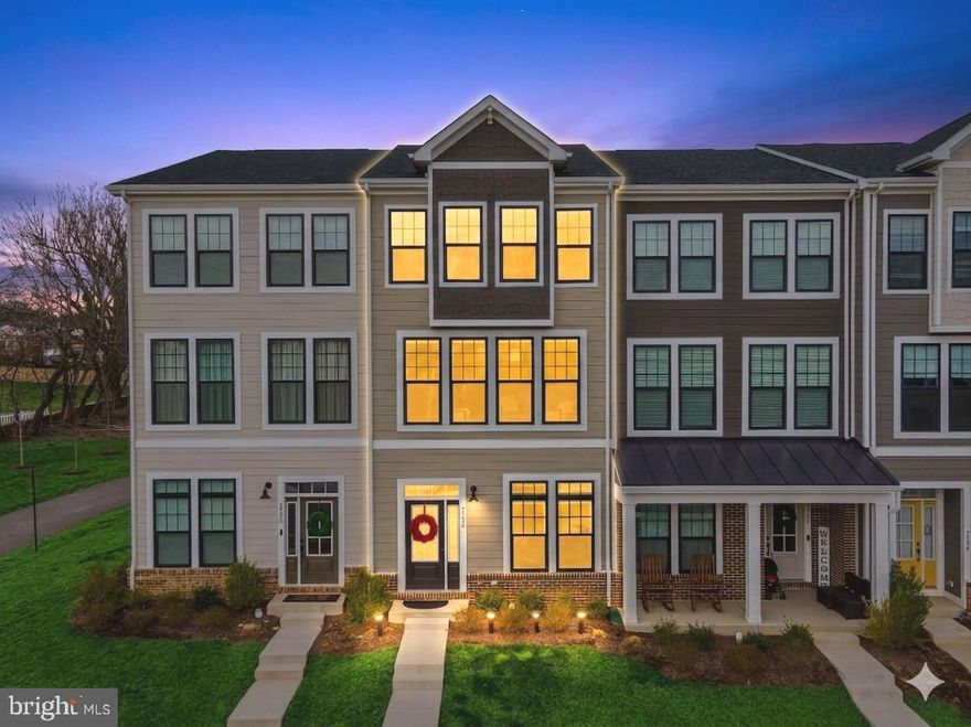 Nestled in the heart of the sought-after Heritage at Marshall community, this stunning 2023-built luxury townhome by Van Metre offers the perfect blend of modern sophistication and small-town charm. Spanning approximately 2,200 finished square feet, the residence features an expansive, open-concept main level designed for effortless entertaining. The gourmet kitchen serves as the home’s centerpiece, boasting a large quartz center island and premium stainless-steel appliances, situated next to the expansive dining area and a beautifully sunlit living room. Flooded with natural light, this airy living space flows directly onto a private rear deck, offering a serene spot for morning coffee while backing directly to lush community green space. High ceilings and sleek luxury vinyl plank flooring throughout the main level create an atmosphere of refined comfort and modern elegance. The accommodations are thoughtfully distributed across 3 finished levels. The upper level features a luxurious primary suite with a spa-inspired en-suite bathroom and a walk-in closet, along with two additional well-appointed bedrooms and a full bathroom. Laundry is conveniently located on this floor as well. Uniquely, the entry-level includes a 4th bedroom- a versatile space that functions perfectly as a private guest suite, a high-tech media room, or a quiet home office away from the main living area. With a total of three full bathrooms and one powder room, there is ample convenience for residents and guests alike. This home also features an attached oversized (18 foot wide) 1-car garage with additional driveway parking and is located just a short walk from community amenities, including a clubhouse, sparkling outdoor pool, and scenic nature trails. Situated in the picturesque landscape of Fauquier County’s wine country, you are just minutes from the I-66 on-ramp and local favorites like the Red Truck Bakery. This property offers a rare opportunity to enjoy peaceful Piedmont living with convenient access to Northern Virginia’s major employment hubs.