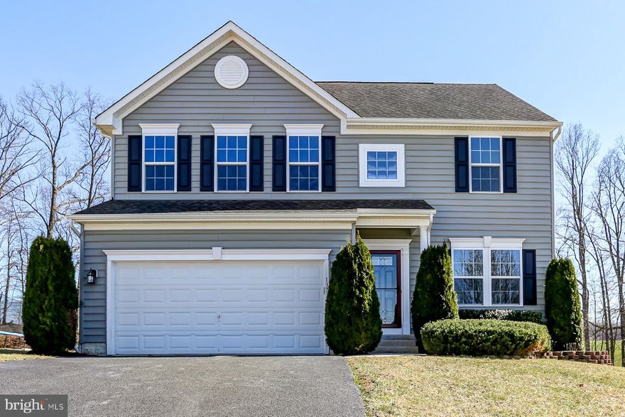 Beautifully Updated Home with Designer Kitchen with Granite Countertops!  Spacious and Open Layout with New Paint and Carpet Throughout, 3 Full Bathrooms and Finished Basement!  Large Master Bedroom with Full Bath and Walk In Closet, Updated Light Fixtures and More! A Must See!