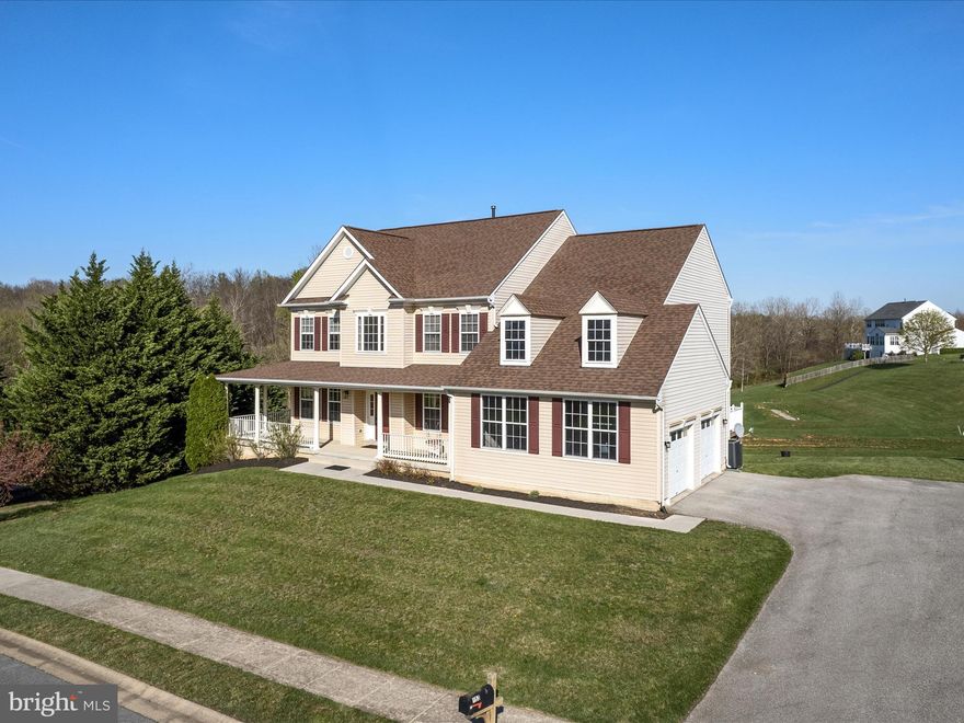 Price Reduced! Updated roof, gutters, and HVAC! Backing to parkland and green space, this expansive 5-bedroom, 4.5-bath home in Craighill Estates offers the perfect blend of comfort, space, and location. Set on over half an acre and tucked at the edge of Happy Retreat Park, you'll enjoy quiet, open views with walkable access to trails and recreation—just minutes from downtown Charles Town and an easy drive to Northern Virginia.

Inside, the home’s thoughtful layout includes formal living and dining rooms, a main-level office with French doors, and a large family room with gas fireplace. The eat-in kitchen features Corian counters, stainless steel appliances, a center island, butler’s pantry/coffee bar, and a built-in desk. Dual staircases lead to the upper level, where you’ll find a generous primary suite with sitting area, walk-in closet, and a spa-style bath with soaking tub, separate shower, and dual vanities. A princess suite with private bath and two additional bedrooms with shared hall bath complete the upstairs.

The fully finished walk-out basement adds incredible flexibility, with a large rec room, additional office or flex space, a 5th bedroom, and a full bath—ideal for guests or multigenerational living. A wraparound front porch, private back deck, and side-load 2-car garage complete the package.

With one of the largest floor plans in the neighborhood and major systems already updated, this is a rare opportunity in one of Charles Town’s most desirable large-lot communities.