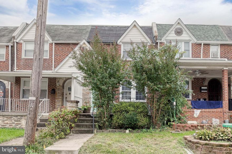If you are looking to live in a classic Baltimore "Charm City" neighborhood, then look no further!  This adorable Dundalk rowhome has been tastefully updated while maintaining it's classic charm.  There is a front porch where you can enjoy a morning cup of coffee while you chat with your neighbors. When you walk through the front door you will be greeted with gleaming hardwood floors and an archway leading into the oversized dining room where you can host holiday dinners.  The dining room is opened up to the modern kitchen with granite counters, stainless steel appliances, a custom tile backsplash, ceramic tile flooring, recessed lighting, and mils of cabinet and counter space.  Upstairs you will find a sleek primary bedroom with moody dark walls and plenty of space for all your furniture.  The 2nd and 3rd bedrooms are a generous size and all of the bedrooms have ceiling fans and share a renovated full hall bath with custom tiling, and a newer vanity.  The lower level is a perfect man-cave or playroom space.  There is an additional full bath in the basement as well. This could even be a home office space, craft room, or anything you can imagine.  Enjoy a summer BBQ outside on the covered paver patio surrounded by a fully fenced yard.  There is even a space behind the fence for 1 car parking.  Welcome home!