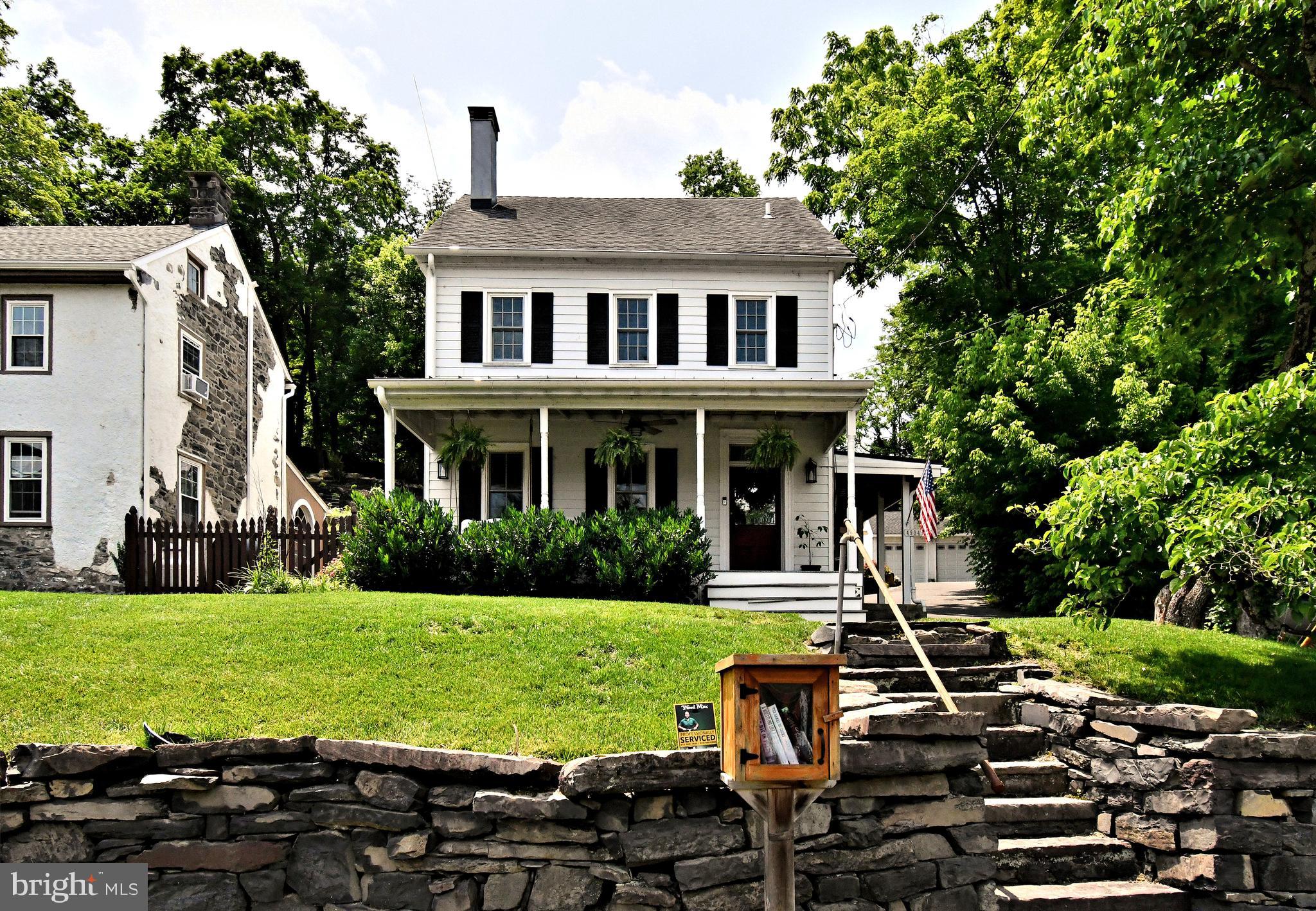 Nestled along the Delaware River in picturesque Point Pleasant, this enchanting 19th-century farmhouse blends timeless charm with modern comfort. The welcoming covered front porch invites you into a home that retains its farmhouse character with shiplap covered walls yet features thoughtful contemporary updates. The bright eat-in kitchen boasts stainless steel appliances, a farmhouse sink, quartz countertops, and gleaming hardwood floors. A newly added sliding barn door reveals a cleverly designed closet/pantry for extra storage. Relax by the wood-burning stove set in a brick hearth, and take in the home’s original architectural details, including exposed stone walls and rustic wood beams, all within the open-concept living and dining areas. These spaces are enhanced by recessed lighting and high casement windows that fill the rooms with natural light. The spacious gathering room offers a cozy retreat with an electric fireplace encased in a striking metal surround. Upstairs, you’ll find wide-plank pine floors, two generously sized bedrooms with ship-lap accents, and a newly renovated full bath featuring dual marble vanities, a clawfoot tub, and a stall shower. On the third floor, a large bedroom awaits, complete with a soaring vaulted ceiling, exposed wood beams, shiplap, stone walls, and its own beautifully updated full bath. Extensive renovations completed including a new driveway, a detached two-bay garage, HVAC system, upgraded pantry & stove, septic system, hot water heater...too many to mention! The new backyard patio, rock wall & landscaping provide a true outdoor oasis. Brimming with historic character and modern conveniences, this home offers old-world charm at every turn. Just steps from the Delaware Canal path, 2 fabulous new restaurants, & minutes to the dining and shopping of New Hope, it’s a dream retreat for outdoor enthusiasts and history lovers alike.