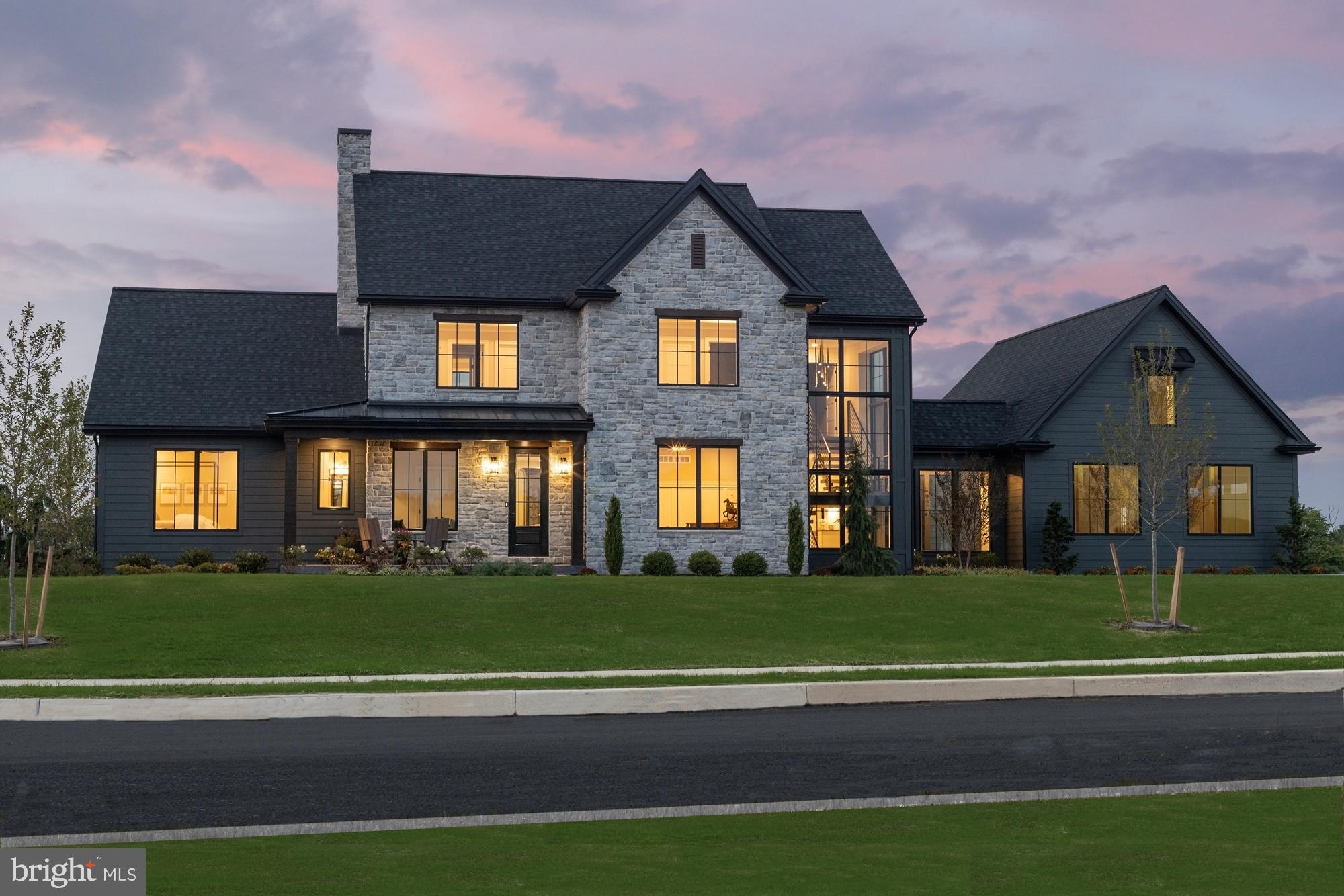Come see the Roland Builder Inc model featured in the Harrisburg Parade of Homes. Roland Builder's custom floor plan with the most up-to-date features and amenities representing the very best quality and craftsmanship clients have come to expect from Roland Builder, Inc. This home has over 5,000 square feet of luxury with 5 Bedrooms, 5 1/2 Baths, 3-car garage and is positioned to maximize gorgeous views of the surrounding valley and golf course. Discover the abundance of luxury as you walk onto the front porch and for the first time walk into the foyer. To the right is the study perfect for anyone working from home with custom built-ins and a large walk-in closet with wainscoting. To the left is the guest suite with full bath and walk in closet. Once out of the Foyer you will enter the dining room and kitchen which leads to the luxurious great room which has an abundance of windows from floor to ceiling giving you endless amounts of natural light. The floor to ceiling stone fireplace is a focal point all the way up to the cathedral ceiling. The Custom appointment ship and superb detail alone is eye catching and evident through-out. Enjoy the 1st floor living at its finest w/modern open floor plan featuring the custom kitchen with hardwood flooring, high-end appliances, walk-in pantry and a large island for entertaining. Attached to the kitchen is the oversized mudroom featuring a walk-in closet, half bath, and lockers with cubbies for coats, hats and backpacks. The modern staircase is also located in the mudroom and features custom iron railing, open risers and a wall of stone, 3-stories. At the top of the steps is the 2nd floor laundry room conveniently positioned just outside the bedrooms. The Owners Suite features a tray ceiling, 2 walk in closets, and Owners bathroom with Pedestal tub, walk-in ceramic shower, and double sinks. The 2nd & 3rd bedrooms each having their own tray ceiling, walk-in-closet and full bath. The lower level is also finished with an additional 1,500 sq feet of livable space having a family room, full bath and 5th bedroom. Other features include: ½” engineered, white oak flooring, stone flooring and porcelain tile, dual zone HVAC, oversized 3-car garage with unfinished bonus room over garage with stair access, central vacuum system and under-floor heating in the breezeway. You will truly love entertaining and welcoming your guests to your fabulous home. And YES, must see to truly appreciate.