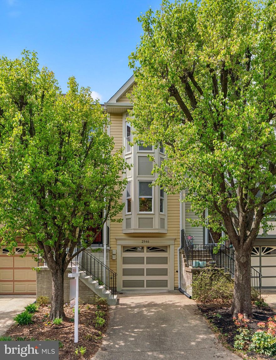 Welcome Home to this Beautifully Updated Townhome in the Popular & Conveniently-Located College View Neighborhood! EnjoyThree Fully Finished Levels with High-End Details Like Crown Moldings & Cornices, Updated Lighting Fixtures and a Fresh Move-In Ready Condition with Neutral Paint, Beautiful Hardwood Floors and New Carpet. The Main Level is Light-Filled and Inviting with a Wonderful Upgraded Eat-In Kitchen with Granite Countertops, Warm Cabinetry and Stainless Steel Appliances. Just Beyond the Kitchen is a Devoted Dining Room Space that Opens to a Large Family Room with a Wood Burning Fireplace, Recessed Lighting & Pretty Views of Trees. Step Out Onto the Expansive Deck and Gaze on the Serenity of the Well-Manicure Common Space with Native Plants and Greenery. Upstairs Find Three Bedrooms, One of Which is a Primary with Vaulted Ceilings, a Bay Window Space, and a Gorgeous Updated Bath with Jetted Tub. The Other Two Bedrooms are Ample and share a Full Bath. The Walk-Out Basement Boasts a Renovated Storage and Laundry Space, and a Recently Refinished Fantastic Au-Pair/In-Law Suite with a Full Bath, Luxury Vinyl Plank Flooring and an Awesome Mini-Kitchen. Take the Sliding Glass Door to a Covered Outdoor Relaxation Space and a Fully Fenced Back Yard. The Long One Car Garage Allows for an Extra Included Refrigerator and Storage Space as Well.  Added Bonuses Include a New Roof with Gutters and Downspouts, Newer Metal Garage Door w/ Bluetooth MyQ Opener, HVAC System and Other Updates Galore! Close Proximity to Shopping, Commuter Routes and the Neighboring Pleasant View Park are a Huge Plus! This Home is an ABSOLUTE MUST SEE!!