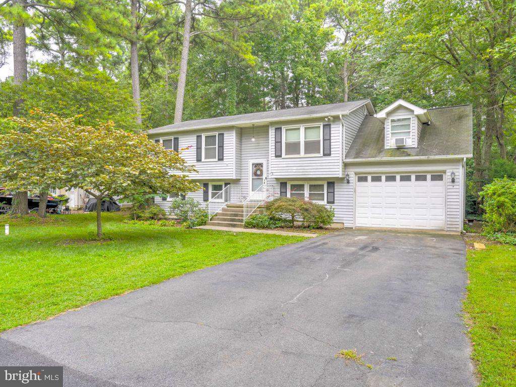 Charming 4-Bedroom Home with Garage Loft & Finished Basement in Drum Point!
Welcome to this spacious 4-bedroom, 2-bath home nestled in the water-privileged community of Drum Point. Offering a functional layout and generous living space, this home features a fully finished basement—perfect for a family room, home gym, or additional entertainment area.
The property includes a one-car garage with a unique loft area, ideal for extra storage or a hobby space. Enjoy outdoor living on the back deck overlooking a nice-sized backyard—great for gatherings, pets, or gardening. The front yard offers additional space and curb appeal.
This home is being sold as-is, giving buyers the opportunity to add their personal touch and make it their own. Windows, HVAC, and water heater are 5yrs old, and the roof was updated 7yrs ago!
Located just minutes from Pax River Naval Air Station, Solomons Island, beaches, local marinas, and waterfront dining, this home offers the perfect balance of privacy and convenience. Enjoy the charm of Southern Maryland living with easy access to nature, recreation, and everyday amenities.