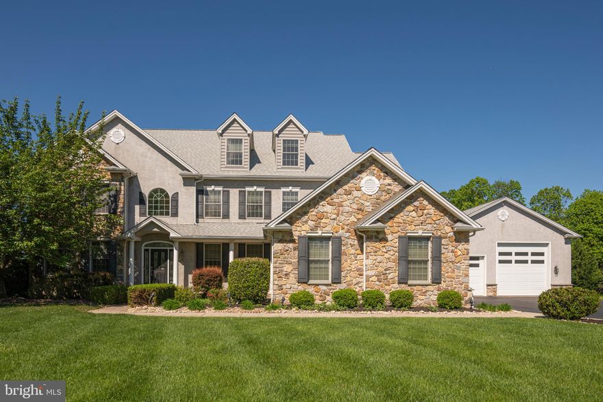 This is the one that you have been waiting for! Stunning custom designed executive home in the The Stables Community in highly desired Methacton School District. One of the most premium lots in the development with an inground salt water pool! Be prepared to be wowed and make it your own! The grand 2 story foyer welcomes you with an elegant Swarovski crystal chandelier and beautiful marble like porcelain tile that flows throughout the kitchen and bumped out morning room with oversized windows to let the natural light come through. The gourmet kitchen  is a culinary dream with double ovens, gas cooking, walk in pantry,  granite countertops, abundant gorgeous cherry cabinetry, and an oversized island with seating perfect for entertaining! The carefully designed open floor plan overlooks the large family room with 5 foot bump outs with a gas marble fireplace and simulated stone accent walls that compliment this magnificent space so well. The formal dining room also bumps out and allows all the room you need for entertaining that flows right into the formal living room. The office is stunning with hand crafted, impressive custom built shelving and recessed lighting. Dual hardwood staircases lead you to the primary suite complete with a tray ceiling, sitting room, recessed lighting and a large walk in closet also with custom wood shelving. The ensuite bath has dual vanities, chandelier, stall shower and an extra large jacuzzi tub.  A relaxation dream! You will love the size of the three large secondary bedrooms with a spacious hall bath and a Jack and Jill full bath.  Need more space - continue up to the extensive third floor loft that adds even more square footage and living space with another full bath and bonus room! As if this isn't enough you will love stepping out to the multi level paver patio overlooking the largest inground pool allowed in the township! Enjoy your summer floating in the inviting salt water pool complete with a  jetted spa flowing into it! So relaxing! This premium lot backs up to woods so you can enjoy nature and serenity while basking in your own oasis.  The enormous  patio is an entertainer's dream with two separate areas, outside speakers and plenty of lounging space on the pool deck. The enormous full size basement has it's own entrance from the garage, plenty of storage and a putting green for your down time! The attached 3 car garage has a breezeway that enters into yet ANOTHER attached oversized heated garage with a full bath and 12 foot door.  Use for your business, boat storage, pool house or convert into an in-law suite! This home just goes on and on with so many possibilities and a newer roof installed 2022! So close to everything this area has to offer and to major routes for easy commuting. Don't miss this dream home- make your appointment today!