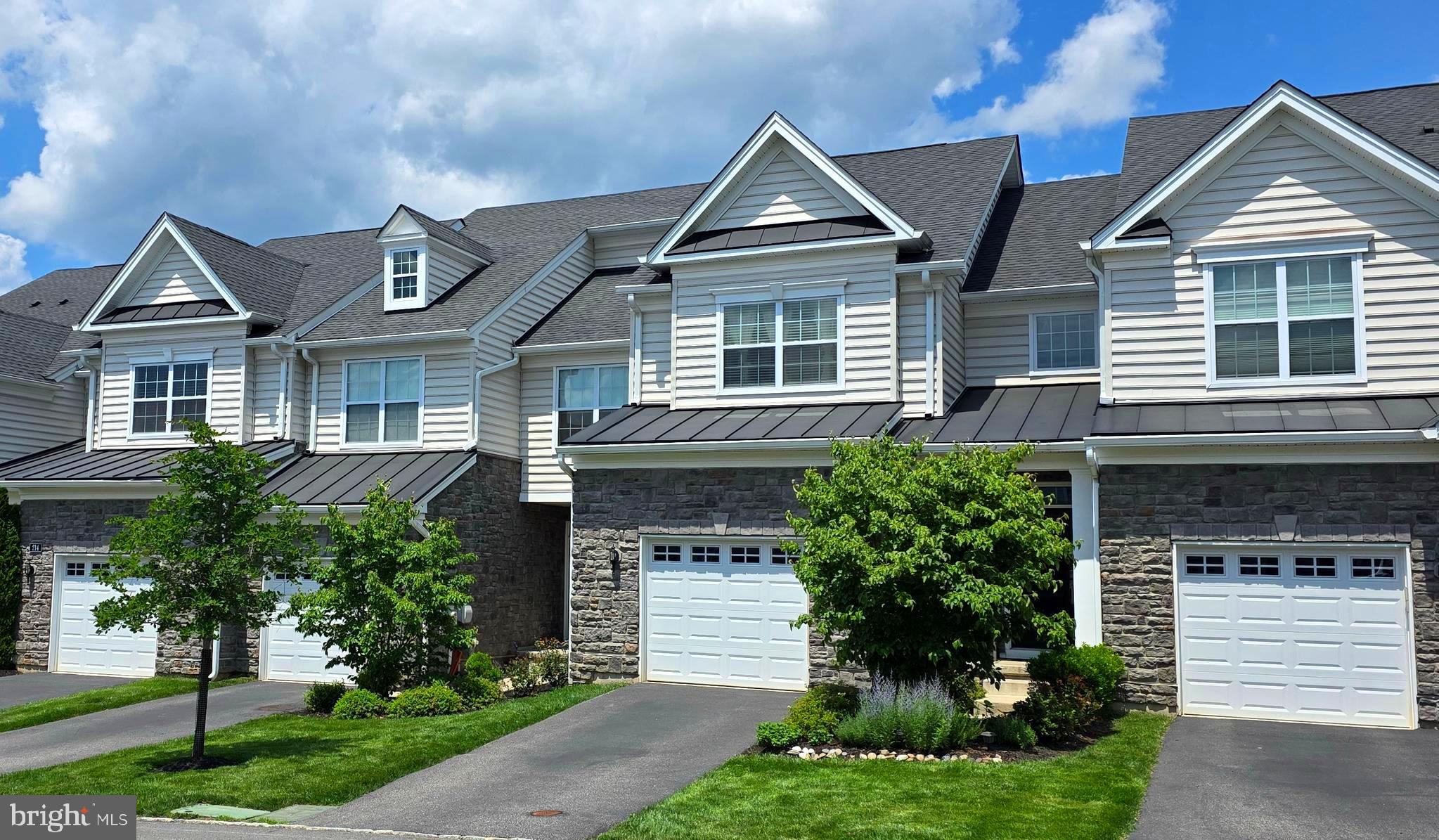 Welcome to a stunning and elegant 3-bedroom, 3.5-bath, 1st-floor primary bedroom, finished walk-out basement with a full bath, situated in the highly sought-after Oaks at Lafayette Hill community. Ready to Move in! This impressive 2,430 sq. ft. home seamlessly blends style, comfort, and convenience. Enter the foyer and instantly experience the spacious and inviting open floor plan, accentuated by Mannington engineered hardwood floors throughout the main floors and recessed lighting that seamlessly flows throughout. The open kitchen serves as the heart of the home, showcasing impressive 42-inch cabinetry, a stylish tile backsplash, and elegantly rounded-edge granite countertops that enhance its appeal. The spacious center island, complete with a granite top, provides ample prep space and features a double-bowl sink that enhances both functionality and seating options. The adjacent great room boasts ample space for gatherings with loved ones, complete with sliding glass doors that extend to a composite deck, perfect for entertaining, enjoying a peaceful moment, or grilling outdoors. The dining area is flooded with natural light, making it an ideal setting for both casual meals and elegant dinner parties. 1st floor primary suite, boasting a walk-in closet, recessed lighting, crown molding, and large windows that flood the space with natural light. The ensuite primary bath features a stylish 12x12 tiled floor, a double vanity, a walk-in shower, and a convenient linen closet. The main level features a laundry room for ultimate convenience, complemented by a conveniently placed powder room and a practical coat closet. The impressive hardwood stairs lead to the upper level, which offers a view of the main level area. The versatile upper open loft area is perfect for an office space, a creative art studio, or even a piano nook. Two generously sized bedrooms offer ample closet space, while the full hall bath features a double vanity and a convenient, practical shower/tub combination. The finished walk-out basement with full bath offers versatile living spaces that can be used as a spacious family room or a flexible bonus room, perfect for a media or game room, playroom, home office, in-law suite, or gym. This home offers a convenient location with easy access to major highways, including 76, 476, 309, and 202, as well as the PA Turnpike, beautiful parks, and the vibrant local scene in downtown Conshohocken. Don’t miss your chance to own this beautiful home in a highly desirable neighborhood! Move-in condition! Easy to Show!