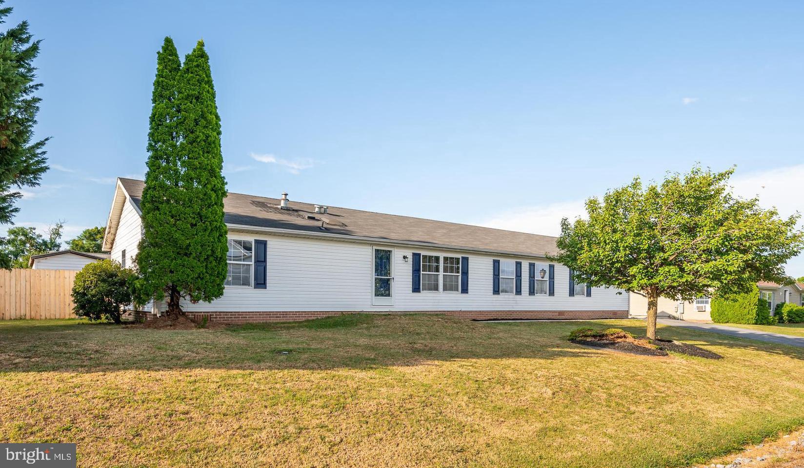 This 4 bedroom 2.5 bath single level home has been nicely updated. The property features a 1/4 acre lot for plenty of outdoor space. There is a large driveway with plenty of parking for guests. Concrete pavers lead to your front door. You enter into the spacious living room with LVP floors and vaulted ceiling. It is open to your dining room featuring LVP floors, track lighting, and glass doors to the rear deck. It opens to the kitchen. The cabinets have been freshly painted. All appliances are updated, stainless steel. There is a double bowl stainless sink. The island provides extra storage and prep space. There is also a walk-in pantry. The breakfast opens to the living room and provides seating for four. The kitchen also opens to the large family room. Here you have LVP floors and ceiling. This leads you into your laundry/ mudroom, machines convey. You have a 1/2 bath for guests. There is convenient driveway access in this room. On the other side of the home you have a large primary bedroom. Your primary suite includes a nice sitting room or office space. The bedroom features LVP floors and overhead lighting. There is a private ensuite bathroom with extended single bowl vanity, 5ft acrylic soaking tub and 4 ft acrylic walk-in shower. The suite is topped off with a large walk-in with shelving. Bedrooms 2 and 3 feature LVP floors and walk-in closets. Bedroom 4 has LVP floors and two closets for ample storage. The hall bath features a single bowl vanity for storage and a tub/shower. Outside the home you have a large deck to host all your summer BBQs. Stairs walk down to your lush, level rear yard. It is fully fenced so, bring your pups! There is a large storage shed for all of your yard tools. This home has everything you want and need. Call for your showing today!