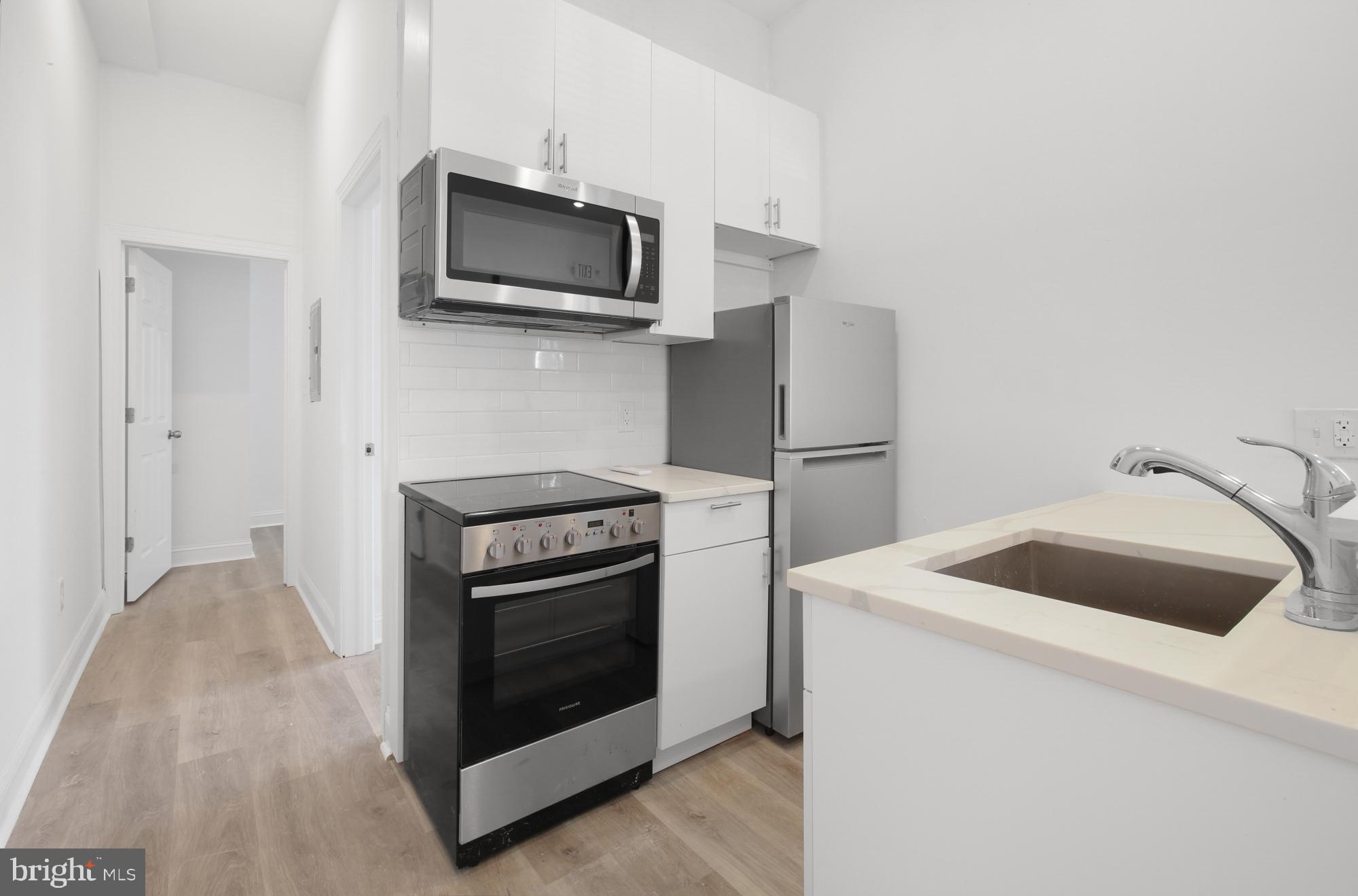 A physical tour is required before applying. Sight unseen applications will not be considered. Available NOW: 2046 E Huntingdon St embraces a minimalist approach to city living. This professionally managed building offers six micro-units designed with simplicity and purpose in mind. Unit #1F is a 2 bedroom, 1 bathroom apartment on the first floor with a private entrance. Each unit features ductless mini-split A/C systems, wood floors, recessed lighting, and clean finishes throughout. Open floor plans and modern fixtures create a bright and functional space, while keyless entry provides added security and ease. The efficiency kitchens are outfitted with white shaker cabinets and stainless steel appliances, offering both style and practicality. Contemporary bathrooms showcase floating vanities, medicine cabinets, and glass shower stalls with rain shower heads and detachable shower heads for a spa-like experience. Some units feature built-in Murphy beds, while others include combined washer/dryer combos for your convenience. At 2046 E Huntingdon St, function meets form in a space that keeps life simple and stress-free. Call for a tour today!
Lease Terms:
Generally, 1st month, 12th month, and 1 month security deposit due at, or prior to, lease signing. Other terms may be required by Landlord. $55 application fee per applicant. Cats and small dogs 35lbs and under are conditional on owner's approval and may require an additional fee, if accepted. (Generally, $500/dog and $250/cat). Strictly no pets over 35 lbs. Tenants responsible for: electricity, cable/internet, and flat monthly water fee ($35 for Studios, $60 for 2BRs). Landlord Requirements: Applicants to make *3x the rent in monthly gross income*, 2 paystubs, tax return must be submitted with all rental applications, credit history to be considered (i.e. no active collections), no evictions within the past 4 years, and must have a verifiable rental history with on-time rental payments. Exceptions to this criteria may exist under the law and will be considered.