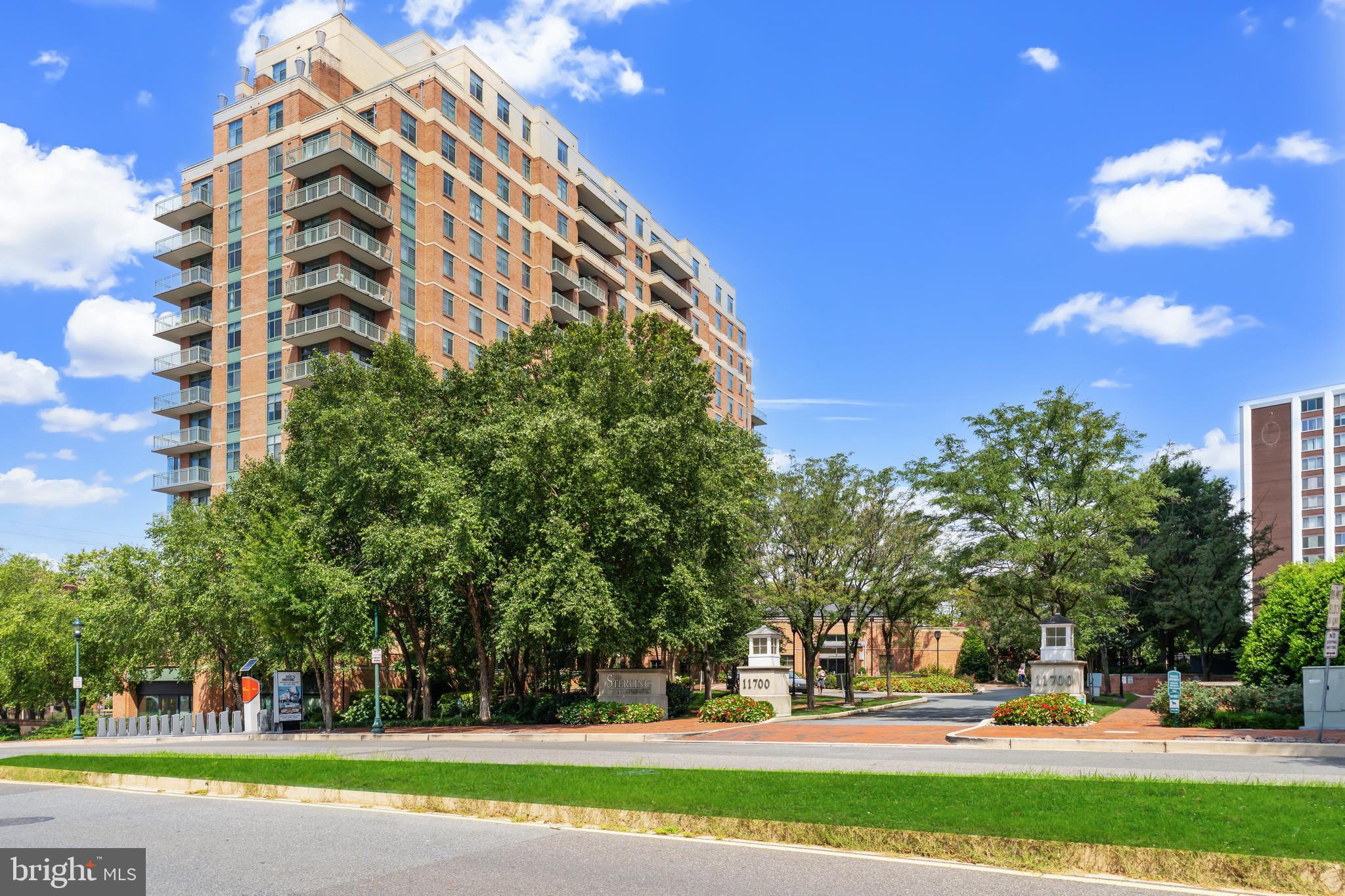 Experience elevated living in this sun-filled condo at The Sterling, ideally located in the heart of North Bethesda. Floor-to-ceiling windows showcase sweeping views and fill the space with natural light, creating a warm and inviting atmosphere.
The Sterling offers a blend of luxury and convenience with 24-hour concierge service, a fully equipped fitness center, a stylish resident lounge with fireplace, and beautifully landscaped outdoor spaces featuring a swimming pool, grilling stations, and garden seating. Pet lovers will appreciate the dog-friendly community, with plenty of green spaces and easy access to nearby parks and walking paths.
Step outside and you’re moments from Pike & Rose, Harris Teeter, White Flint Metro, and a wide array of restaurants, shops, and entertainment—all just a short walk away.
This residence also includes an upgraded in-unit washer/dryer and a secure, assigned garage parking space.
