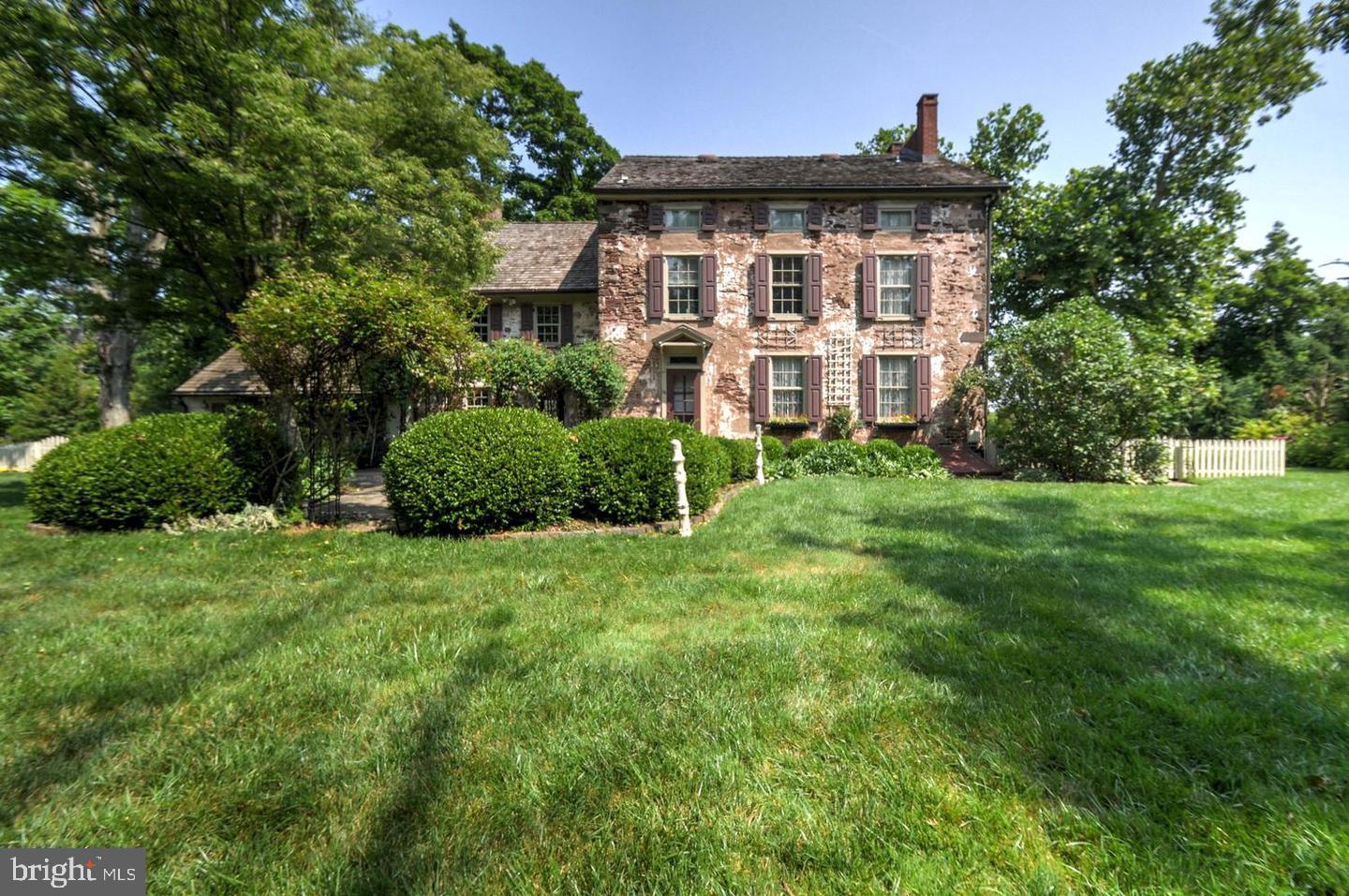 One of a kind historic home now available. Beautiful 4 bedroom, 3 1/2 bath home is rich in history. Built in 1753 and is on the National Register of Historic Homes overlooking the Jericho Mountains. Formerly the Eagle Tavern, hosted pioneers and travelers on the old rural highway, hotel with ballroom, voting headquarters, post office and local store. This 3 story, solid stone home with thick walls is full of charm and character. This home has newly refinished, random width pumpkin pine flooring throughout. Freshly refinished deep, thick window sills and window seats. High ceilings on the first floor and most upper floors with many cathedral ceilings. Kitchen has commercial gas cooking stove with Jennair downdraft fan, 7' island and granite counter tops. Dining room has a sitting area and 7' solid field stone walk-in fireplace with beautiful 12" thick solid wood lintel. Spacious master bedroom with windows overlooking the open field and Jericho Mountains. Master bath has bidet, claw foot tub and stall shower. An abundance of exposed beams throughout. The home has been updated including HVAC, freshly painted, 400 amp electrical system, whole house generator and new upgraded and expansive wireless internet. The guest suite has full bath complete with original stone converted fireplace and steam shower. Butler stairways to second floor and basement with wine cellar and walk-out. An abundance of built-in closets and original lock sets and hinges. Newer 3-car Amish built garage with custom doors and finished second floor with hardwood floors and post and beam construction and HVAC. There is also an office built into the second floor of the carriage house. Recent updates include newer fencing, 2 blue stone patios with landscaping, furnace, basement windows and frames, powder room, exposed stone wall, refinished hardwood floors and window sills, and new gazebo. Private tennis court and in-ground swimming pool is yours to enjoy! This home also make an amazing Bed & Breakfast or an excellent Air BNB opportunity! Award winning Council Rock School District. Minutes from great shopping, restaurants and parks!