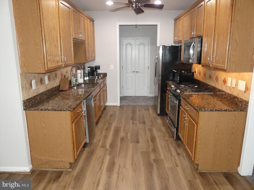 1st FLR-PATIO-PRIVATE ENT-1600+SQFT. NEW HVAC 8-23. GOURMET KIT W/42" OAK CAB'S, GRANITE C-TOPS, BREAKFAST NOOK, RECESSED LITES, SS APPL'S, NEW PLANK FLR, GAS COOKING, B-IN MICRO, FRIG W/H2O & ICE DISP. FLEX RM/OFFICE OFF KIT W/CABINET'S. FRESHLY PAINTED. HUGE LIV RM & DINE RM W/MOLDINGS GALORE. FOYER W/W-IN CLOSET, COAT CLOSET & NEW PLANK FLR. PRIMARY BEDRM W/DBL BOWL VANITY, OVERSIZED SHOWER W/SEAT & LINEN CLOSET. BED & BATH 2 AT OPP END. STORAGE RM/LAUNDRY RM W/WASHER & DRYER. 3 CEIL/FANS. ASSIGNED PARKING-CONTINGENT ON DISABILITY CLUBHSE W/KIT, FITNESS RM, MEETING RM & OUTSIDE PATIO.