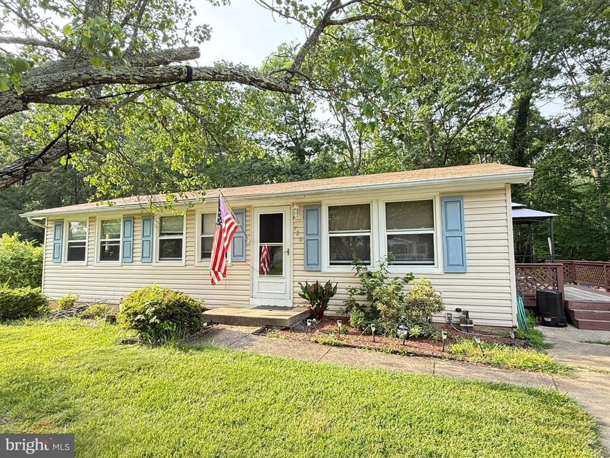 Tucked away on a quiet street on the outskirts of Waldorf near Accokeek, this 3-bedroom, 1-bath rancher offers a great opportunity for buyers ready to add their personal touch. The home sits on a level lot with off-street driveway parking and features a side entrance into the kitchen, which includes a convenient pass-through to the living room. An attached rear shed offers extra storage, and the backyard backs to trees for added privacy. Virtually staged photos help you envision the possibilities in the living room and bedrooms.  The property will need some work and is priced to reflect its current condition. With its convenient location near shopping and commuter routes, this could be the perfect place to build equity or create your ideal home.