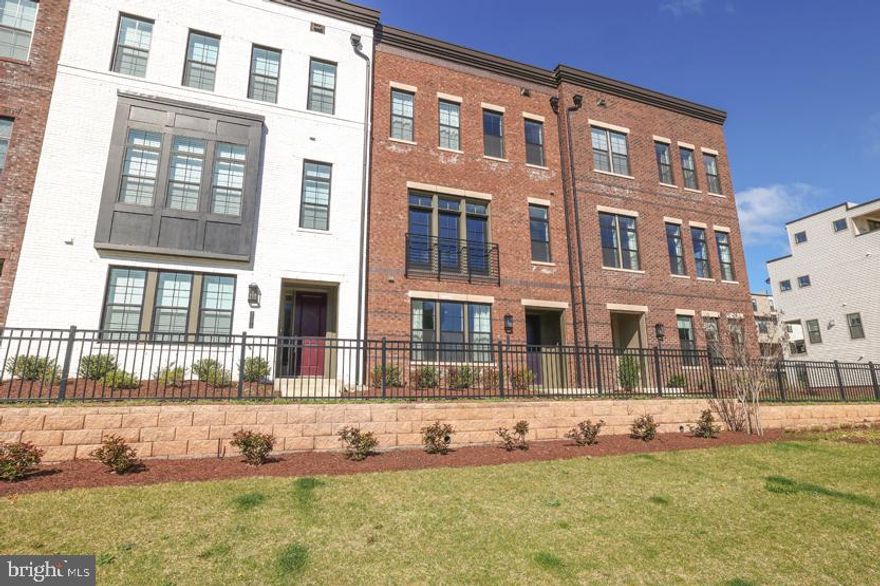 Discover the allure of Metro Walk at Moorefield Station, an exquisite master-planned neighborhood nestled in Ashburn, VA. Offering impeccably crafted new construction townhomes, this community is tailored for individuals craving both accessibility and versatility in their lifestyle. Whether you want the comforts of home or the excitement of exploration, Metro Walk beckons with abundant opportunities to revel in the outdoors or unwind indoors. Elevate your contemporary and refined way of life by making Metro Walk at Moorefield Station your home. This beautiful new construction townhome features 5-bedroom, 3- full bathroom , 2- half bathroom townhouse spans 4 levels and is conveniently located less than a mile from the Silver Line Metro. The first floor features a unique and beautiful hardwood foyer/entry, a bedroom/office with a full bath, and access to the rear 2-car garage with a bonus Telsa Charger and room for storage. The main level offers an open floor plan with a spacious living room, kitchen, and dining area adorned with hardwood floors. Step out onto the private patio right off the kitchen to enjoy a nice breeze. The gourmet island kitchen boasts granite counters, stainless steel appliances, and floor to ceiling cabinets for lots of storage. The house is naturally well-lit, with a half bath on the main level. The upper level features a spacious master bedroom with a walk-in closet and double vanity master bathroom with quartz counters with a spacious walk in shower. Two additional bedrooms share a full bath on this level. The laundry area includes custom closet storage, with additional closets for storage throughout.  The top level features a full living room and a half bath leading to a spacious terrace, perfect for family gatherings and enjoying a beautiful day. Conveniently located near dining, shopping, and entertainment options, with easy access to metro and major commuter routes like Dulles Toll Road/Rt. 267, Route 7, and Route 28 offer advantages like a prime location within walking distance of the Ashburn Metro Station and onsite amenities.. Enjoy a hassle-free lifestyle in a low-maintenance community with included snow removal and lawn care. Explore meticulously designed floor plans tailored to diverse preferences. Experience exceptional amenities such as a clubhouse, resort-style pool, trails, and playgrounds. Located in the esteemed Loudoun County school district, including Rock Ridge High School, Stone Hill Middle School, and Moorefield Station Elementary.  Available for rent May 1, 2024. RentSpree Online Application to apply.