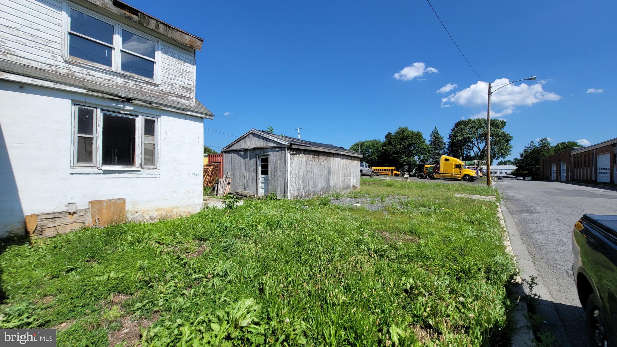 Level lot with small office building and two garages. 1257 Chester St is conveniently located just two blocks off of the Rt 12 bypass and near some commercial buildings / properties. Perfect opportunity for a contractor looking for some parking and an office. The office building needs renovations, but is otherwise solid. City of Reading, R2 zoning allows for housing and many other uses. Look for attached .pld file with R2 zoning specifics.
