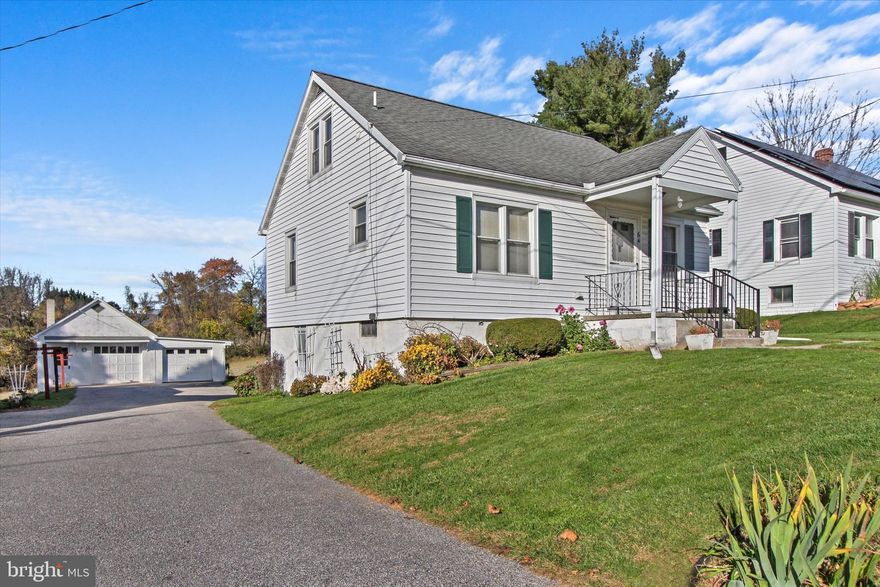 Affordable housing is found in this 2-3BR Cape Cod located in Dallastown! Walk to town conveniences, close proximity to Dallastown Schools. Garage lovers will delight in the detached, oversized 2-car block garage, with pull down attic storage and plenty of room for tinkering or storage.  One side, 17x21, has overhead door and opener. The other side, 13x21, has overhead door.  Large driveway with lots of off-street parking. Well-maintained home has a flexible floorplan you can customize to meet your needs. The 1st floor features a living room, eat-in kitchen, bedroom and a large full bath/laundry room. If you would prefer more dining space or a 1st floor office, instead of a 1st floor bedroom, there are two bedrooms on the 2nd floor.  There is also a walk-out lower level, with three rooms one of which has a toilet and stall shower only. Two covered porches and a nice backyard also come with the home. Gas heat, updated roof, windows, siding, bath and kitchen.  Property is being sold "AS-IS," but the condition is very good!  AGENTS - Please read Agent Remarks!