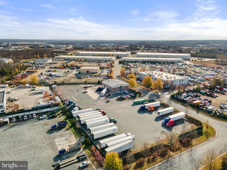 Approximately 1.3 acre lot for sale in Hornbaker Industrial Park.  Fenced yard is zoned M-1 (Heavy Industrial) in Prince William County.  Excellent location near Prince William Parkway, US-28 and I-66. Located on the Corner of Robertson Drive and Mike Garcia Drive.  GPIN # 7596-71-7435.