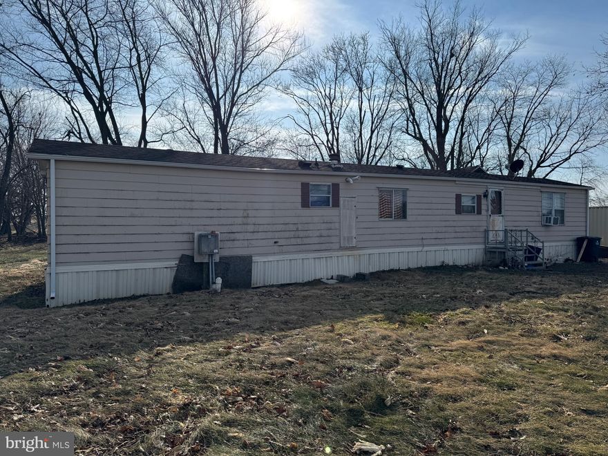 This property will be offered at Public Auction on Saturday, February 28, 2026 @ 10am.  The listing price is the opening bid only and in no way reflects the final sale price.  10% down due at auction, 2% transfer tax to be paid by the purchaser, real estate taxes prorated. This country property is surrounded by farmland and features a three bedroom mobile home. The home offers a cozy living room, a kitchen, a dining area, three bedrooms, two full bathrooms, and a dedicated laundry area. Additional amenities include a two-car garage and easy access to shopping centers, restaurants, as well as Routes 30 & 896. Don’t miss this great opportunity in the heart of Lancaster County!