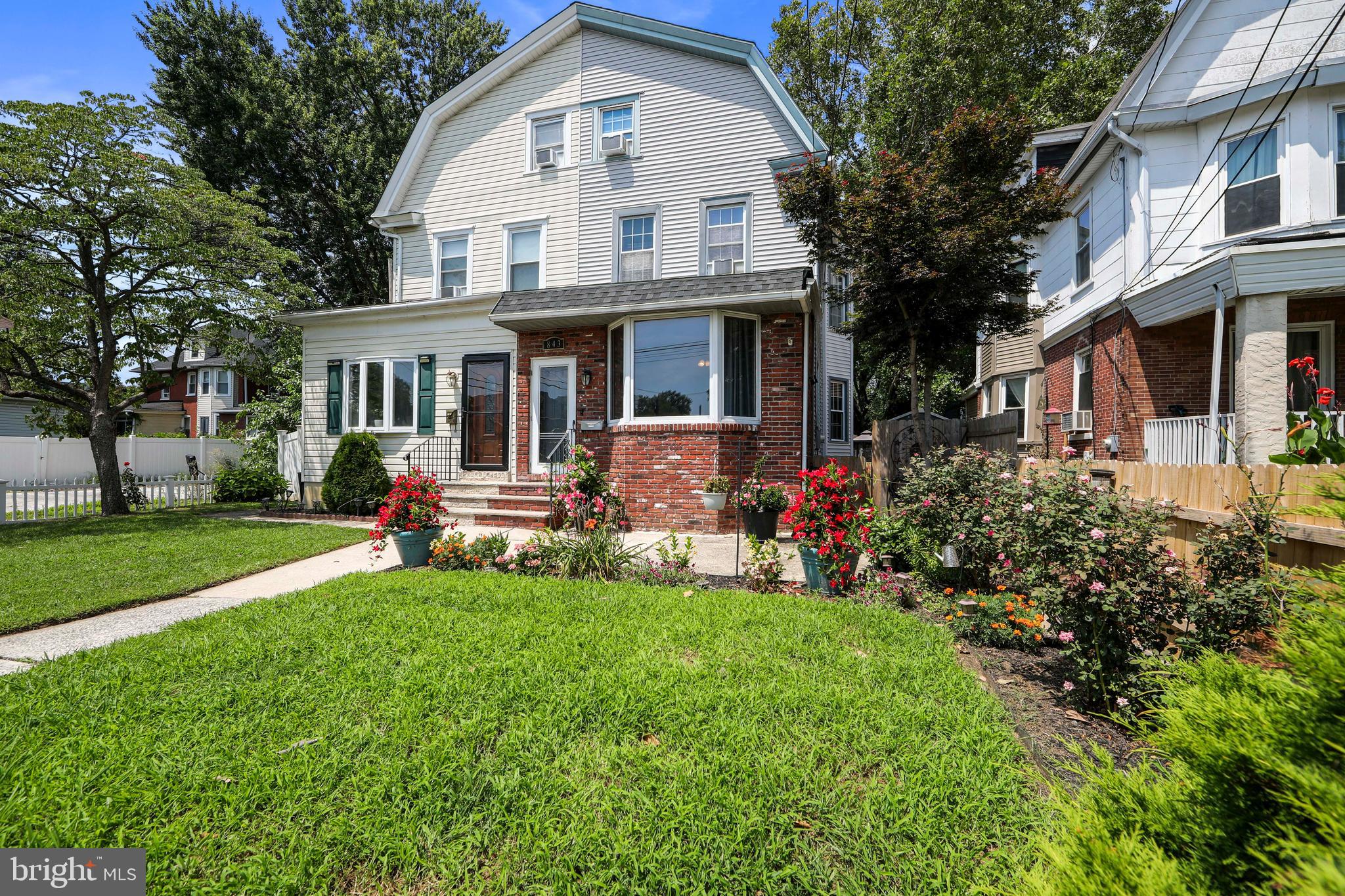 MOVE-IN READY! Welcome to this beautifully maintained Twin Home located in desirable Prospect Park, offering curb appeal, a manicured lawn, and thoughtfully designed landscaping.
Step inside to find gleaming wood floors throughout the main level. The spacious, extended living room features a charming fireplace and a large bay window that fills the space with natural light and offers lovely views of the front yard. Adjacent to the living room is a formal dining room with classic chair rail detailing, perfect for hosting dinner parties.
The Eat-in kitchen is a chef’s dream, featuring white cabinetry, granite countertops, custom tile backsplash, a flush-mount sink, double ovens, breakfast bar, center island, and a cozy breakfast room. A convenient powder room completes the main floor.
Upstairs, you'll find three generously sized bedrooms and a full hall bathroom. The third floor boasts a private master suite complete with a comfortable sitting area—ideal for a home office or reading nook.
The partially finished basement offers a large family room, perfect for movie nights, a playroom, or a home gym.
Step outside through sliding glass doors from the breakfast room to your private backyard oasis. Enjoy outdoor living on the Trex deck, overlooking a covered brick paver patio and a fully fenced backyard, perfect for entertaining or relaxing in peace and quiet.
Lovingly maintained and thoughtfully updated, this home is truly move-in ready. Schedule your private showing today!