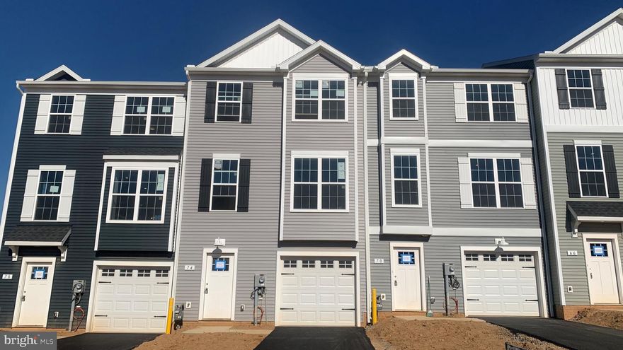 Price reduced for a quick move in.  Take advantage of the great price! Affordable brand-new construction townhome in Red Lion features up to 1720 SQFT.  Offering a low-maintenance lifestyle, our homes include a car garage with 3 bedrooms/2.5 bathrooms just minutes away from great outdoor activities and the area's top-ranking school districts. Centrally located, Red Lion is an ideal location for those commuting to the major Maryland metropolitan areas in Baltimore and Washington and the York and Harrisburg areas. On the main living level of this Interior home, it welcomes you to an enormous Kitchen featuring shaker White cabinets, granite countertops, and stainless-steel appliances with an island. The Kitchen opens onto a bright, airy Living Room, perfect for entertaining, featuring upgraded lighting fixtures and low-maintenance flooring. Upstairs are two spacious bedrooms with ample closet space, a hall bath, upper-level Laundry, a generous Owner's Bedroom with a cathedral ceiling, a huge walk-in closet, and an En Suite bathroom with granite countertops and shaker cabinets. On the entry level, you will have the convenience of a powder room and finished recreation room that will walk out to your yard.
