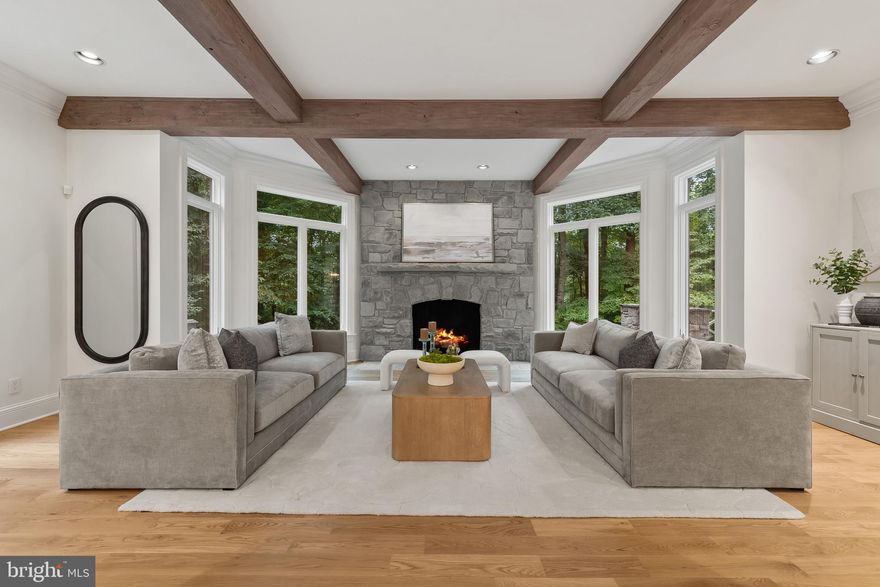 VIP SUNSET OPEN HOUSE,  Wednesday, Nov. 12  @ 3-6pm.   Welcome to this exquisite and newly renovated custom-built estate nestled in the prestigious Residences of Caves Valley Golf Club, overlooking the green of the signature par 3 - 3rd hole. As you enter through the barrel-vaulted archway, a grand estate drive unfolds, leading to a meticulously landscaped motor court, adorned with lush gardens, a tranquil water fountain, and a flagstone walkway that guides you to the stunning main entrance. Inside, a two-story foyer with a graceful staircase introduces you to the elegance and sophistication that defines this luxury home.  Brand new 5" white oak floors throughout the first level, upstairs landing, and lower level living areas create a feeling of comfort as well as sophistication.  The main level features high ceilings and an expansive living and dining room with new custom interior design and finishes by award-winning designer Laura Hodges Studio.  Interesting architectural details, a wood-burning fireplace, and built-in bookcases all work together to create a warm, inviting atmosphere.  The gourmet kitchen, equipped with top-of-the-line Bosch appliances, a Viking range with six burners and a griddle, and a Monogram wine fridge, is a chef's dream. The quartzite glass backsplash adds a modern touch, while the walk-in pantry provides ample storage. Adjacent to the kitchen, the sun-drenched breakfast area flows seamlessly into the Family Room, featuring a beamed ceiling and a second fireplace, perfect for cozy gatherings. The main level also includes a private two-story guest bedroom or au pair suite with a full bath and a second-level sitting area ideal for extended family or guests.  A home office or playroom, mudroom with cubbies, and a second office provide versatility for modern living. Upstairs, the sumptuous primary suite is a true retreat, featuring a fireplace, two custom-fitted dressing rooms, and a spa-like bath with marble heated floors.  Two additional en-suite bedrooms, one with a spacious third-floor loft, offer comfort and privacy. The lower level is an entertainer’s paradise, complete with a family room with a wet bar, a media room, a game room with a fireplace, a full bath, and a potential gym.  The homeowners installed a Reverse Osmosis total home purification system by Atlantic Blue Water,,  new HVAC units and updated electrical systems  in the house.  Outside, the expansive Ipe hardwood deck, stone patio, and terrace provide multiple areas to enjoy the serene surroundings. The professionally landscaped 3.75-acre lot includes an herb garden, and space for a future pool or even a par-3 golf hole. The home also features a three-car garage with epoxy floors and cedar shake exterior, adding to its timeless appeal. Whether relaxing in the primary suite, enjoying the designer lighting, or envisioning future outdoor possibilities, this stunning estate offers a lifestyle of unparalleled luxury and sophistication.  Caves Valley Golf Club Residences offers an extraordinary lifestyle that combines the allure of luxury living with the beauty of a world-class golf course. Live in an exclusive community in a coveted destination. Imagine stepping out of your home and onto the greens for a round of golf at your leisure. Whether you are an avid golfer or simply appreciate the beauty of this very special community, this extraordinary living destination provides an unrivaled experience.