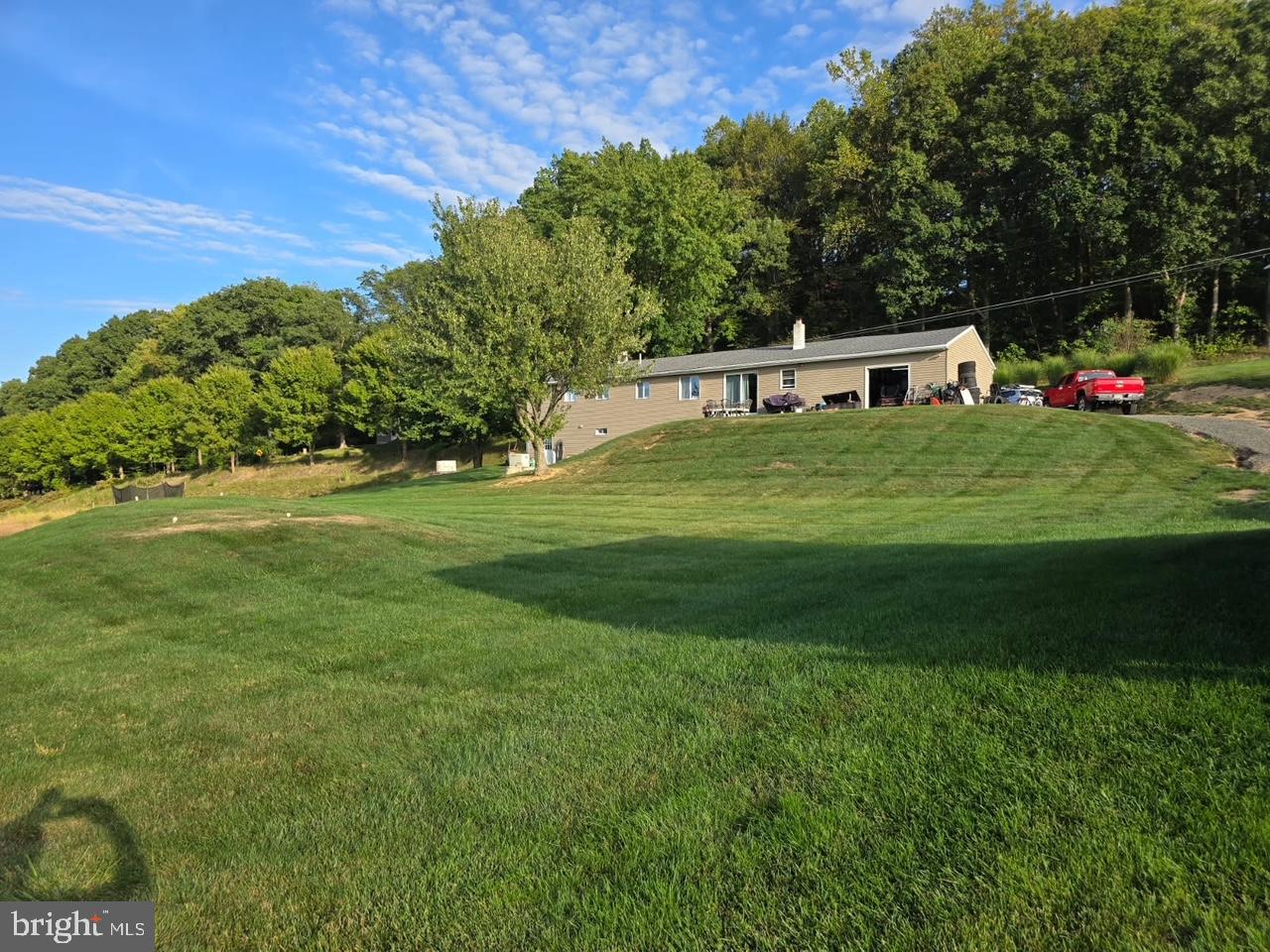 Discover this charming 3-bedroom, 2-bathroom ranch-style home, perfectly situated on a generous 0.85-acre lot. This well-maintained residence boasts a partially finished basement which includes a bonus room which can be used as an office/bedroom and full bathroom, offering endless possibilities for additional living space or storage. The kitchen has recently been updated and additional cabinets and butcher block counter top have been added.The exterior features durable aluminum and vinyl siding, ensuring low maintenance for years to come. Enjoy the convenience of an attached garage with rear and side entry, providing ample parking for up to six vehicles. The outdoor area is perfect for gatherings or outdoor activities. Inside, the layout is designed for comfort and functionality, with excellent property condition throughout. This home is ideal for those seeking a peaceful retreat while still being close to local amenities. Embrace the potential of this delightful property and make it your own!