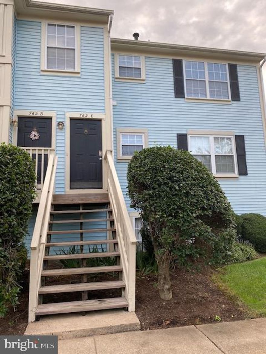 Delightful  condo in the Cedars of Warrenton!  This well maintained home  is in great condition,  new HVAC and windows,  professionally cleaned carpets and neutral colors throughout.  Spacious open layout with vaulted ceilings!  Sunny kitchen offers granite counters, pantry and inviting nook for casual dining.  Large living & dining room with balcony access.  Wooded views of common area from balcony and primary bedroom.  Separate laundry room includes full size washer & dryer, furnance, hot water heater & storage.    Generous primary and bedroom 2 offer ceiling fans.  Primary bedroom features walk in closet, wooded views and bath w/ dual vanity, linen closet and fresh white tiled tub w/shower .  Updated hall bath in great condition.  Balcony also offers storage closet.  1 assigned parking space (762C) & 1 visitor pass  with unit.  Water & trash service are included in rent.  Tenant will be responsible for gas, electric, and internet.  Tenant must provide proof of renter's insurance and payment  prior to move-in.  Online Application  with a $55  fee per adult.