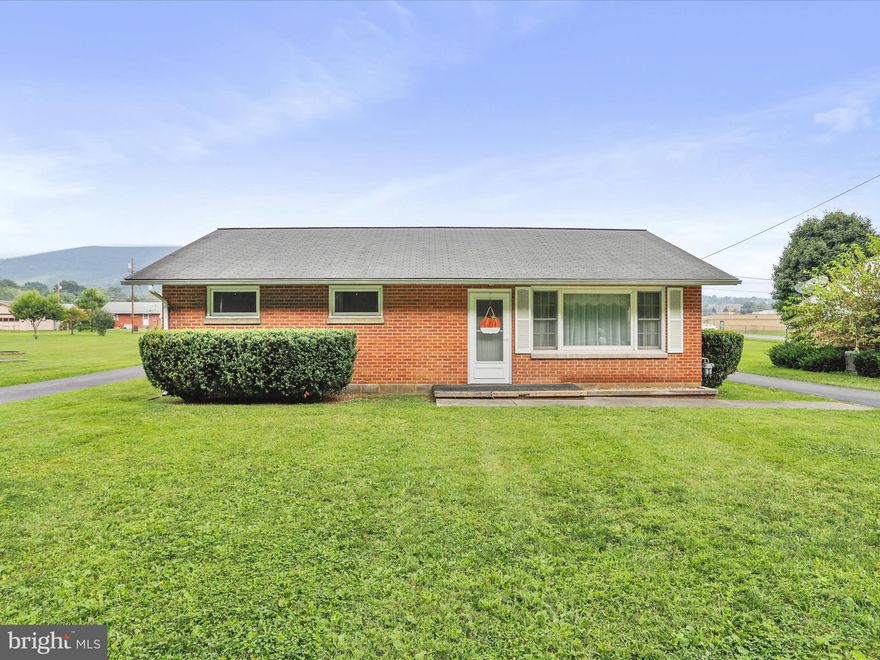 Welcome to this adorable brick ranch home featuring 3 bedrooms and 1 bathroom, perfectly nestled on a large, level lot. Enjoy the timeless appeal of solid construction paired with the tranquility of beautiful mountain views right from your doorstep.  Inside, you’ll find a cozy layout filled with natural light, making each room warm and inviting. The spacious lot provides endless possibilities—whether it’s gardening, entertaining, or simply relaxing outdoors while taking in the scenery.  Located in a peaceful setting yet convenient to local amenities, this home is ideal for anyone seeking both comfort and charm.