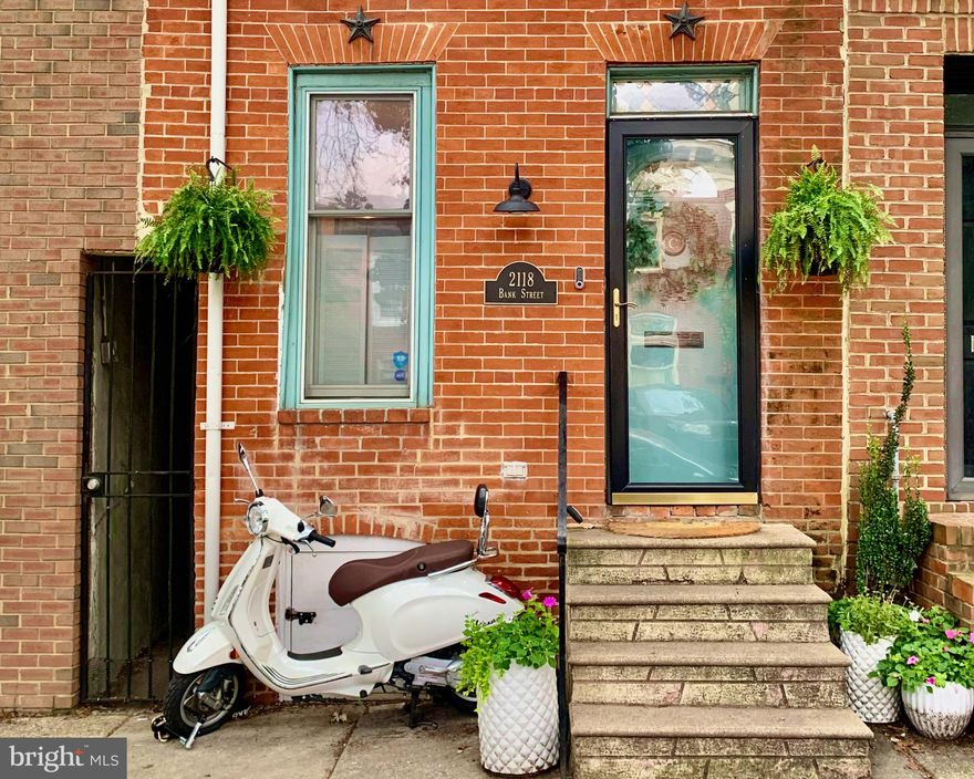 Welcome home to this 1920's charmer in Upper Fells Point. Tremendous location just 2 blocks from Patterson Park and 3 blocks from the Fells Point waterfront. This home features 3 levels of finished living space and a rooftop deck. The main level has an expansive living room leading to the chef's kitchen. The dining room is accented by two walls of windows overlooking the fenced rear yard with custom vertical gardens. The second level includes the primary suite with dual closets, a second bedroom and additional full bathroom. The third level offers a bonus room, great for additional living space, home office, exercise area, and more. Endless views from the rooftop deck with sightlines to many iconic Baltimore landmarks.