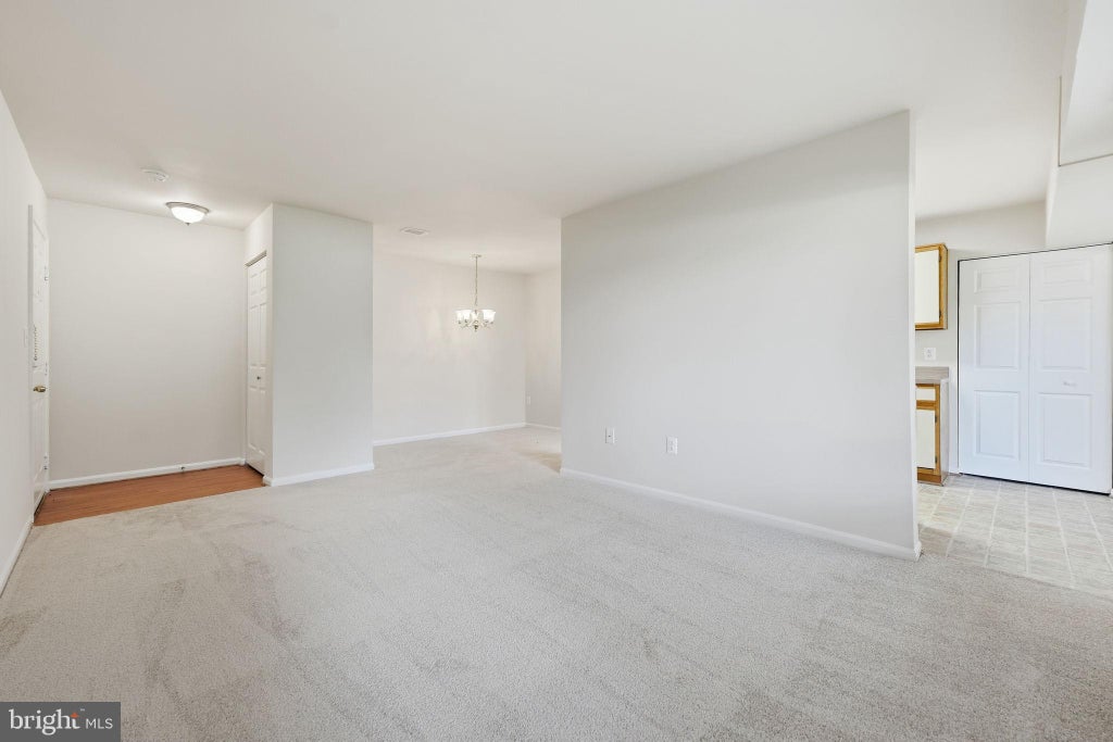 Photo of 8372 Buttress Ln #102, MANASSAS, VA 20110 (MLS # VAMN2011810)