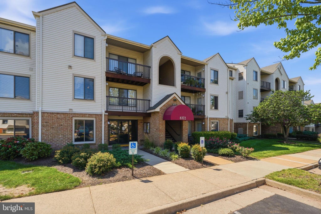 Photo of 8372 Buttress Ln #102, MANASSAS, VA 20110 (MLS # VAMN2011810)