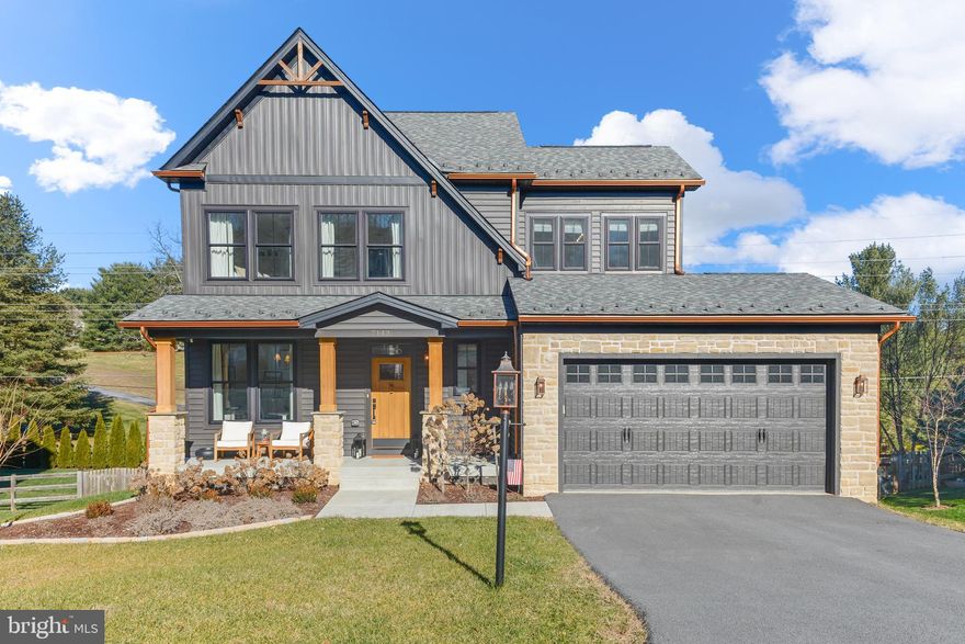 Custom built just two years ago by C.E. Rensberger, this stunning Craftsman style home has been thoughtfully customized from top to bottom with no detail spared. From the moment you arrive, the copper porch lighting sets a designer inspired tone and hints at the elevated finishes found throughout the home.
Inside, honey haven colored Mannington LVP engineered flooring flows throughout the main level, complementing the open floor plan that allows for effortless movement and entertaining. Just off the entry is a beautiful private office that can also function as a first floor living space. The gourmet kitchen features stainless steel appliances, quartz countertops, a marble inspired backsplash, and maple cabinetry by Reico Kitchens. A show stopping custom pantry with built in shelving and glass doors feels straight out of a design magazine. There is ample space for a large dining table, making the kitchen the true heart of the home.
The family room is warm and inviting with a custom cedar beam and a stunning travertine surround propane fireplace, perfect for chilly days. Custom light fixtures and window treatments elevate every space. Step outside to a gorgeous screened porch that adds valuable outdoor living space, with a Trex deck just beyond and steps leading down to the backyard.
Upstairs, board and batten detailing and an oak staircase lead to four bedrooms. The primary suite offers engineered LVP flooring, a walk in closet, and a stylish en suite bathroom with double vanity. Three additional carpeted bedrooms share a second full bathroom, and the laundry room is conveniently located on the bedroom level.
The fully finished lower level features oak stairs, full windows that provide abundant natural light, a second family room, and a customized entertaining bar with leathered granite countertops. A half bathroom, generous storage space, and room for a home gym complete the lower level, which walks out to the backyard.
Outside, the outdoor living space is thoughtfully designed with Nicolock stone edging that ties the backyard seamlessly to the landscaped front of the home. Beginning at the basement walkout, the stone pathway guides you to the firepit area, creating a cohesive and inviting flow for outdoor entertaining. The backyard is fully fenced, offering both function and privacy.
Additional highlights include a 240 volt EV charging station in the garage and upgraded insulation with spray foam behind traditional insulation for enhanced comfort and lower heating and cooling costs.
Located in Lake Linganore, residents enjoy access to four swimming pools, twenty miles of trails, and two private beaches with direct lake access, offering an exceptional lifestyle of recreation and community. Buyer to pay a .5% of sales price fee for community at closing.