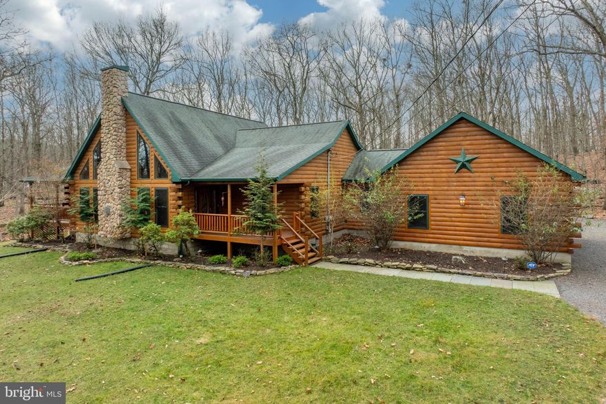 Welcome home to 1212 Acacia Dr in Hawley, PA, nestled in the picturesque Pocono Mountains. Looking for a memorable family escape in a luxury community? This impeccably maintained log cabin sits on a serene 2.2 wooded acres in the highly desirable Hidden Lake Estates, near the coveted Lake Wallenpaupack. Offering the perfect blend of rustic elegance and modern amenities, this 5,246 sq ft home features 6 bedrooms, 3 bathrooms, and everything you need for year-round enjoyment. Inside, you'll find a two-story vaulted great room with a stunning stone fireplace, creating the perfect ambiance for cozy evenings. The beautiful kitchen boasts granite counters, stainless steel appliances, and is complemented by a thoughtfully designed dining room—ideal for hosting gatherings. A loft above the kitchen adds additional charm and functionality to the space. The main floor also features a convenient laundry room and a two-car garage, adding to the home's practicality. The thoughtfully designed interior includes a game room and home theater, making it perfect for entertaining. Step outside to enjoy two private decks, a screened-in porch, a cozy fire pit, and a tranquil water feature—perfect for embracing the great outdoors. As part of the exclusive Hidden Lake Estates community, you'll have access to a serene private lake, ideal for kayaking, canoeing, swimming, and fishing. The home's proximity to Lake Wallenpaupack and Wallenpaupack Beach further enhances its appeal. In the winter, you're just a short drive from popular ski resorts and water parks, making this home an all-season haven. Whether you're seeking a weekend retreat or a forever home, this exceptional property delivers the ultimate Poconos lifestyle. Schedule your private tour today and experience the magic for yourself!

Audio and/or video recording devices may be in use on the premises. By entering the property, buyers and their agents acknowledge and consent to the possibility of being recorded during showings.