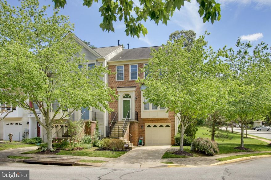 Sitting on a corner lot, overlooking the vast lush green community space is the most perfect end of group garage townhome you can imagine.  The living and dining room are open to each other and the perfect entertaining space.  The kitchen offers a sun drenched breakfast nook with wooded views, center island for added prep space, custom light bright cabinetry, designer tile backsplash, and stainless steel appliances.  The primary bedroom suite is a true luxury retreat with an oversized sitting room with vaulted ceilings and skylights so you can gaze at the moonlight and relax after a long day at work.  The deluxe primary bathroom has been completely renovated with a giant shower and soaking tub surrounded by custom tilework, and a double vanity so you have plenty of counter space.  The 2nd/3rd bedrooms are both a great size with plenty of closet space.  The lower level is the perfect man-cave or playroom with a walkout to the rear patio.  If you like grilling than you will love this deck that overlooks the woods for privacy.  Don't miss this one, it will go fast!