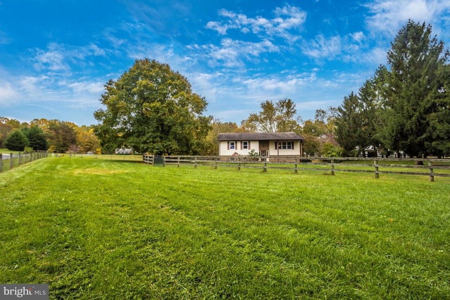 What a lovely setting for a 3 acre farmette in nearby Mt Airy.  The entire property is nicely fenced and cross fenced for dogs or livestock with board and 2" x 4" No Climb fence.   It is currently set up for horses with a charming recently constructed 2 stall barn with 11 x 11 matted stalls, water and electric. Three storage sheds for additional equipment, hay and feed.  A Nelson auto waterer will make life easier.  Lots of outdoor living spaces with gardens, a fenced area with blueberries and even room for a future pool ++.
The home has had some updates and is in need of some cosmetics but is perfectly livable AS IS.  The home has several replacement windows, updated electric and more.  There is equity here for the taking for a buyer that is willing to put in a little elbow grease! This type of lot and setting for the price is hard to come by in Mt. Airy.