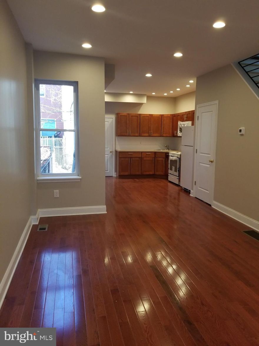 Newly rehabbed three bedroom and 1.5 baths.  Located near Septa , Drexel Field, University of Penn & Drexel.  The house has a new heating system with central air, new roof, plumbing, electrical, hardwood floors, mantle with custom brick finish and new interior steps with a hardwood floor finish.  Laundry on the first floor with a washer & dryer, custom kitchen with refrigerator and microwave range, Custom interior railings and recess lighting in living room and kitchen.  Nice size bedrooms with ceiling fans and lots of closet space.  There is a new cement floor in the basement where you will find a new powder room.  Serious Applicants Only:  Criteria:  Application fee for each applicant.  NO EVICTIONS, credit and background check, monthly income must be 3X the rent to be considered.