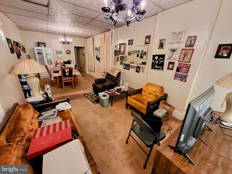 Welcome home to this charming family abode!  This residence is located in a developing area with a comfortable living room, three sizeable bedrooms, and a huge backyard!  For the right owner, this home offers a unique opportunity.  The opportunity to improve the home's value as it would make for a great rental or residence.