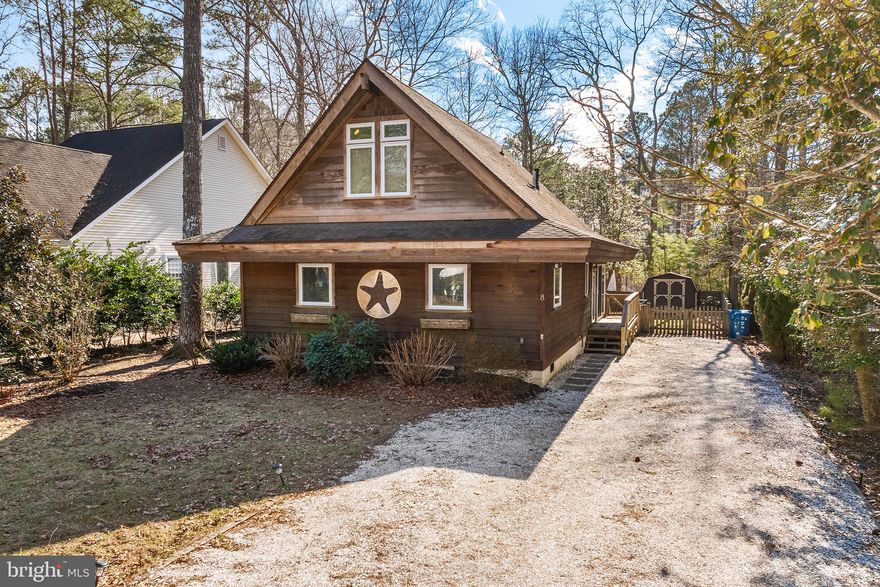 Nestled in the picturesque community of Ocean Pines, 8 Seagrave Lane is a charming A-frame bungalow.

This single-family home offers 3 bedrooms and 2 full bathrooms across 1,236 square feet of living space. The main level features a nice living room with wood burning stove, sunroom, and kitchen stainless steel appliances, and recessed lighting. There are two bedrooms and one full bathroom and laundry on the main level, providing convenient single-level living options. The upper level houses an additional bedroom and full bathroom with jetted tub, offering privacy and flexibility.

The home features nice paved patio with a pergola, providing ample outdoor space for recreation and relaxation.

As part of the Ocean Pines community, residents have access to a variety of amenities, including parks, recreational facilities, and waterfront activities. Move-in ready!