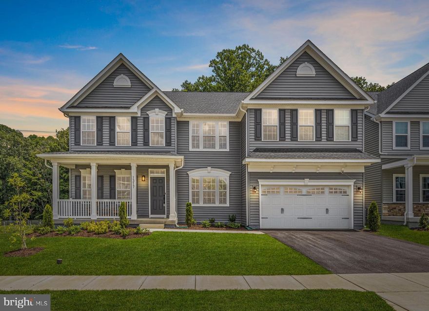 Maryland’s local brokerage proudly presents 1317 Upper Patuxent Ridge Rd in Odenton, MD. The sellers relocation can be your gain. This like-new 2022 Cosica model home in the coveted community of Two Rivers has every upgrade you could ask for. It features 6 bedrooms, 3.5 bathrooms, and over 5,200 sqft of living space with finished basement. Walking up to the home you first notice the charming covered front porch. On the main level there is LPV flooring, recessed lighting, and excellent sightlines to the back of the home. There is a designated office with double doors, large separate dining room, family room with  driftwood marble floating gas fireplace, an eat-in kitchen with quartz countertops, stainless steel appliances, an oversized island, and large pantry.  Sliding glass doors lead you to the spacious covered composite deck with vinyl railing and stairs to the large flat fenced backyard with a white vinyl privacy fence. This property sits on a premier lot nestled along  a wooded area  and an open space leading to even more wooded views.. There is a mud room off the kitchen and a cubby nook that leads out to the 2-car garage. On the second level there is upgraded carpeting for comfort, 4 spacious bedrooms with large closets, and an oversized game room that could be used as an additional bedroom. The primary suite has a sitting area, private bathroom, and two walk in closets. The primary bathroom has a roman shower with double shower heads, frameless glass, two vanities with extra storage, and upgraded lighting. The basement  has upgraded carpet and a large family room with a wet bar and drink fridge. The basement also boasts a guest bedroom next to a full bathroom and a large room that can be used as a 6th bedroom or theater room/gym. The large utility room has space for storage and is equipped with a tankless water heater  to ensure the water is always hot. The home has a whole home water filtration system as well as an under the kitchen sink reverse osmosis system. There are 2 HVAC systems with humidifier, and a passive radon mitigation system. Honeycomb blinds are installed throughout every window besides the laundry room. The basement movie room/gym is already wired for a projector. No stone was left unturned with this thoughtful build. Avoid the build-time wait and save money with this beautiful home on a premier lot. This community is truly the best of both worlds - close to all Baltimore, Annapolis, and DC has to offer while being tucked away in a quiet resort-style community. This community is equipped with a clubhouse and meeting space, game room and fitness center, outdoor competition size pool, basketball & multi-sport court, tennis and sand volleyball, playgrounds, biking and hiking trails, community garden and environmental park, dog park, outdoor patio with fire pit, and more. Welcome home!