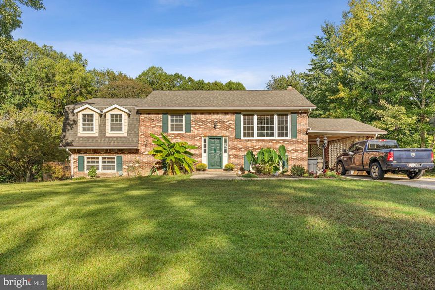 This spacious and well cared for home offers wonderful possibilities. On the top level there is a large living room and a bright eat-in kitchen that opens onto an expansive deck. The top level also includes 3 nice sized bedrooms, a full hall bathroom, and a full bathroom for the master bedroom. The lower level includes another large living area with a wood burning fireplace, a full bath, and 2 more large bedrooms. Hard surface flooring throughout - no carpet! Additionally, the lower level has a nice combined workshop, laundry room and utility room with plenty of storage space. New HVAC unit in 2021. But that's not all! This home has a gorgeous fenced-in backyard that is made for outdoor living with a well maintained in-ground salt water pool and a huge bright green lawn with lots of sun that backs on to the woods. Make this charming Waldorf property with convenient nearby shopping and restaurants your next home with years of enjoyment in store!