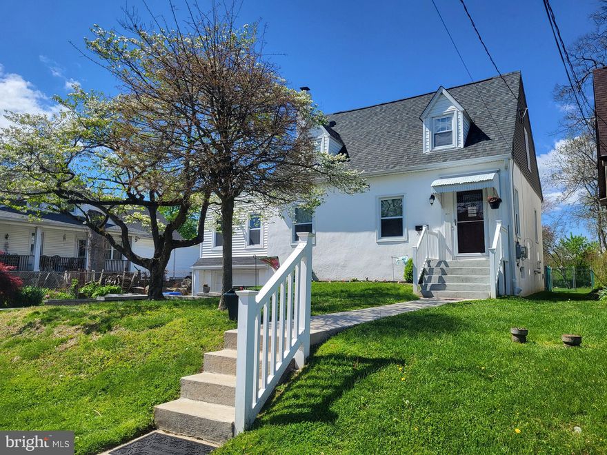 Stunning 4-bedroom cape-style home with updates and improvements throughout and ready for its new owner to enjoy! The main floor features an entrance foyer, a spacious & bright living room with beautiful yellow birch hardwood flooring, and a gorgeous and open eat-in kitchen, also with hardwood flooring, as well as dark stainless Samsung appliances (including a gas stove and double oven), loads of cabinet, shelf, and drawer storage space, granite counters & peninsula, and a nice tile backsplash. The main floor also offers a 4th bedroom/bonus room with an updated full bathroom and a private office space. The second floor features a primary bedroom with two closets, a second updated full bathroom, and two additional bedrooms, both with ample closet space. The full basement offers tons of storage and has lots of potential for additional living space as well as access to the one-car attached garage, which has a new concrete floor. The new driveway and retaining wall offer an additional two private parking spaces and there are another 1-2 spaces cut out in the front of the house on the street as well.  The large, covered rear deck off of the kitchen overlooks the extra deep and level fenced yard with an included above-ground pool and playset. Updates include a brand new roof in 2020, replacement windows,  new insulation & drywall throughout the entire house, all new 200amp electrical service, all new ductwork, PVC & PEX plumbing, and gas piping. This house is basically like new construction but without the hefty tax bill plus it's convenient to just about everything...I-95, the Philadelphia Airport, public transportation, shopping, and dining. Schedule your appointment today to view this amazing home, buy it, and be ready to unpack, kick off your shoes, and enjoy everything that it has to offer!