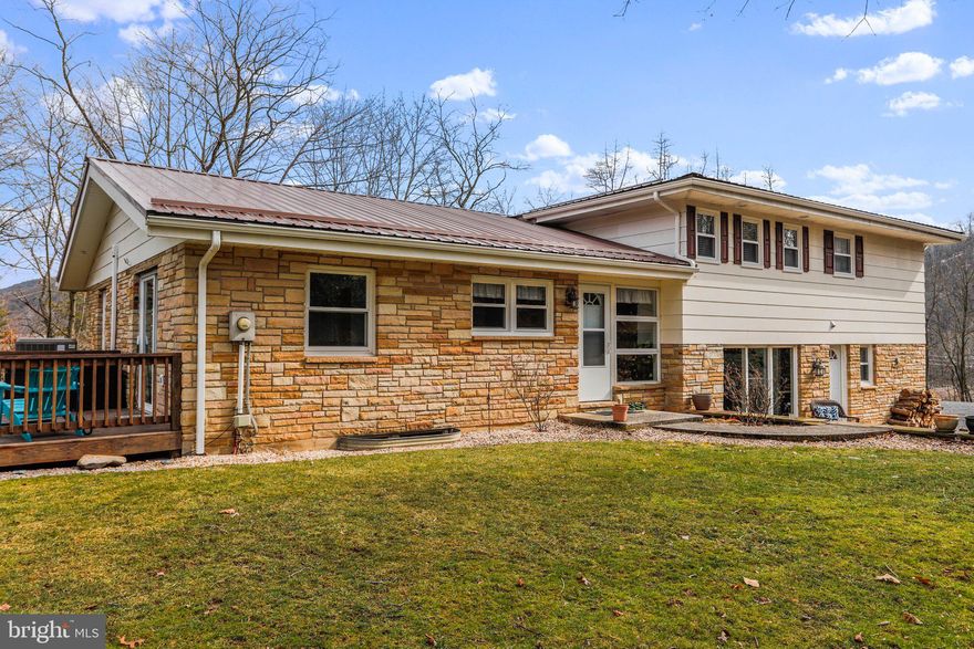 ONE OF A KIND.  You've heard that phrase before -- now come and experience for yourself!  This 3 bed / 2.5 multi-level beauty is truly a rare find.  Nestled on over an acre of Wild and Wonderful West Virginia this home boasts almost 3,000 square feet.  Situated atop of a peaceful knoll, you have panoramic views of the best West Virginia has to offer.  The updates on this one are endless-- from the roof, to the rear deck, to the updated floorings, baths, and wet bar. There's space for everyone with this one and the multi-level living provides ample room for entertaining. The office area could easily be used as a potential fourth bedroom OR you can certainly finish the lower basement level to whatever your heart desires!  It's hard--darn near impossible-- to find this in the New Creek area... don't miss out!