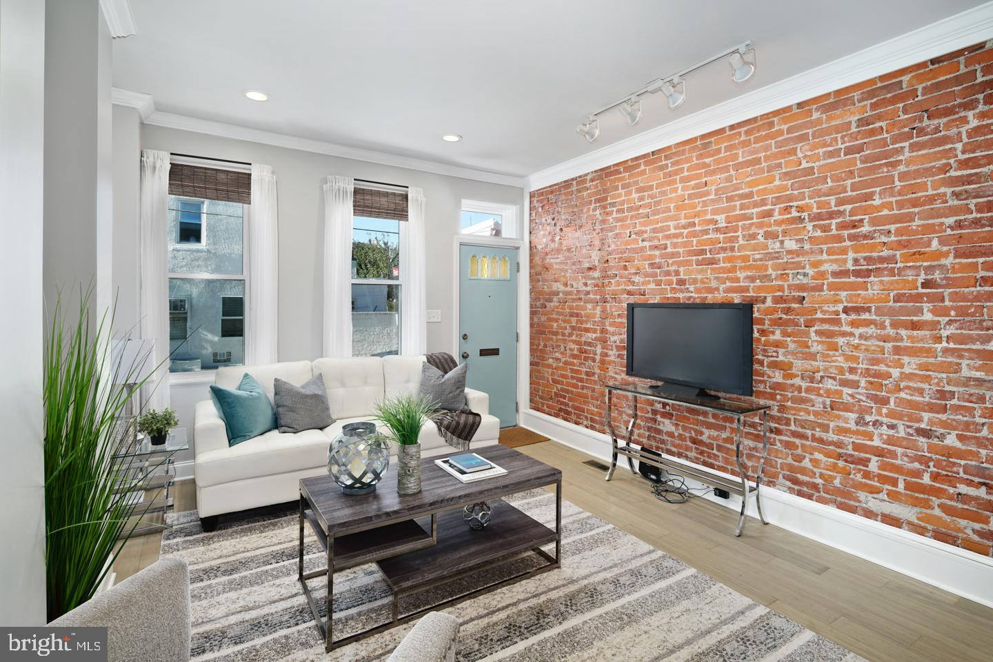Beautifully renovated 2 Bedroom 1 Bath home with dedicated PARKING located in Fishtown, which was recently ranked by Forbes magazine as the hottest zip code in America. Walking into the home you will notice a completely renovated first floor open floor plan. The style is the perfect blend of modern and classic. Exposed brick, modern flooring, and classic moldings highlight the living and dining room area. Into the kitchen you will find high end custom cabinetry, quartz countertops, subway tile backsplash, and an upgraded appliance package. Off the back of the kitchen there is a large deck with plenty of privacy, which serves great for entertaining. Also, outback is the dedicated off-street parking spot which was recently refinished with pavers. Upstairs you have two bedrooms, a large full bathroom with double vanity, and walk through closet with built-ins. The home also features all newer mechanicals throughout. The location is a quick walk to many Fishtown hot spots, and easy access to highways and public transportation. Also, right outside you back door is Cicone Recreation Center, which is a great public park for outdoor activities and sporting events. Don't miss out on this rare opportunity to own a renovated home with parking right in Fishtown!