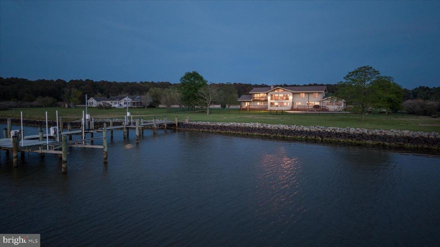 Endless westerly vistas stretch across Madison Bay, delivering breathtaking sunsets that feel like a private showing each and every evening. This is more than a home—it’s a waterfront sanctuary designed for those who expect their lifestyle to be as elevated as their surroundings.

Welcome to Saltmarsh, an extraordinary 8.5-acre estate where luxury, privacy, and coastal beauty converge. With 5 bedrooms (plus a bonus room the could be considered a 6th) and 3 full bathrooms, this property effortlessly transitions between an exceptional full-time residence and the ultimate weekend retreat for unforgettable gatherings with friends and family.

Spanning over 5,000 square feet, the home is thoughtfully designed to maximize both space and scenery, with walls of windows that flood the interior with natural light and showcase those sweeping bay views from nearly every room. The main level is nothing short of an entertainer’s masterpiece—an open-concept layout anchored by a stunning great room, seamlessly flowing into a chef’s gourmet kitchen and sun-drenched sunroom on one side, while the opposite wing reveals a full-scale game room complete with a pool table and custom bar built for hosting on any scale.

Step outside and the experience only gets better. Multiple expansive decks offer the perfect setting for everything from quiet mornings to lively evenings, all framed by panoramic water views. At the private dock, every detail has been accounted for—featuring water and electric, two jet ski lifts, and a 10,000-pound boat lift—creating a true waterfront playground.

The oversized 3-bay garage provides ample space for all your water toys, equipment, and more—because a property like this is meant to be enjoyed without compromise.

Offered fully furnished, Saltmarsh is completely turnkey—allowing you to step right into an effortless, elevated coastal lifestyle from day one.

This is not just a home—it’s a statement.