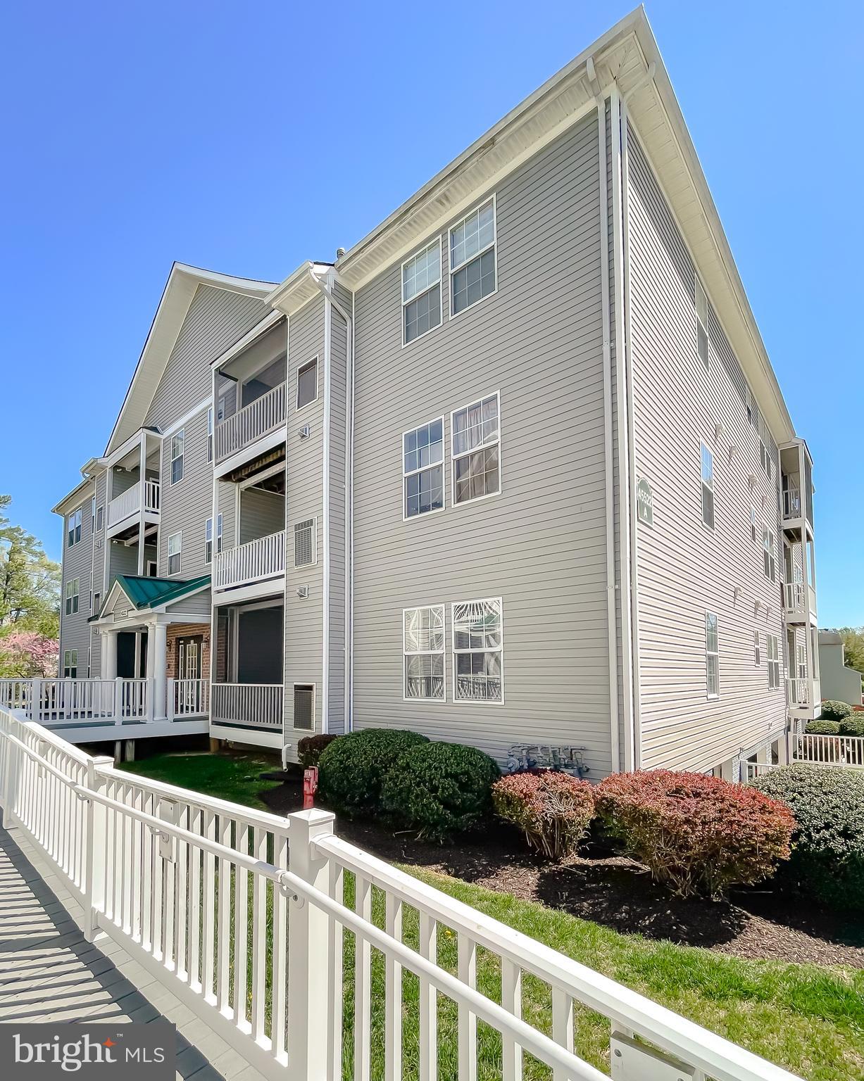 Convenient Condo with open layout, and spacious bedroom! Situated just minutes from PAX, shopping, restaurants, and major commuter routes, this main-floor, 1-bedroom, 1.5-bath condo provides comfortable, open-concept living. Kitchen features Oak cabinets, stainless appliances, and pantry closet. Enjoy a breeze out on the balcony with extra storage/utility closet. Plenty of room for the big screen TV in the living/dining area. The bedroom has an attached bath with double sinks, and two walk-in closets. Foyer half bath for guests. Two assigned parking spaces & extra storage unit in the lower level, covered garage w/elevator. Great community amenities include an outdoor pool, tennis, clubhouse, fitness room and playground. No grass cutting or exterior maintenance makes for easy living! Don't miss your opportunity at this convenient condo, request your showing today!