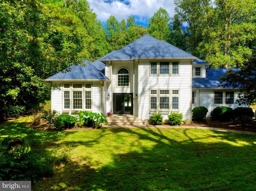 A rare offering of timeless elegance and privacy, this serene 5-acre country retreat is the perfect haven for gatherings with family and friends. A long gravel driveway winds through mature trees, leading to a gracious double-door entry and a custom-built residence with an open, light-filled floor plan. At the heart of the home, a chef’s kitchen showcases premium stainless-steel appliances and a walk-in pantry, seamlessly flowing into both formal and casual living spaces. Two inviting living rooms with wood-burning stoves, a refined dining room, and a luxurious primary suite provide spaces designed for comfort and sophistication. The primary suite is a true sanctuary with a spa-inspired bath featuring a whirlpool tub, private sauna, walk-in shower, and expansive walk-in closet.
Natural light streams through skylights and broad windows, framing views of the sparkling in-ground pool and manicured grounds. Beyond the main residence, the property offers three additional guest bedrooms, a detached studio/office that may also serve as a nanny suite, and ample parking with a three-car garage, plus a separate fourth RV garage equipped with 220 voltage.  Three large sheds tucked at the rear of the property with infinite possibilities... work room, children's play house, additional storage and a charming fenced vegetable and flower garden. With no HOA restrictions, you’ll enjoy complete freedom to make the property truly your own.
Tucked away at the end of a private drive and surrounded by natural beauty, this retreat blends refined living with tranquility—just minutes from the beach. A property of this caliber must be experienced in person to be truly appreciated. Please contact me for a private tour.