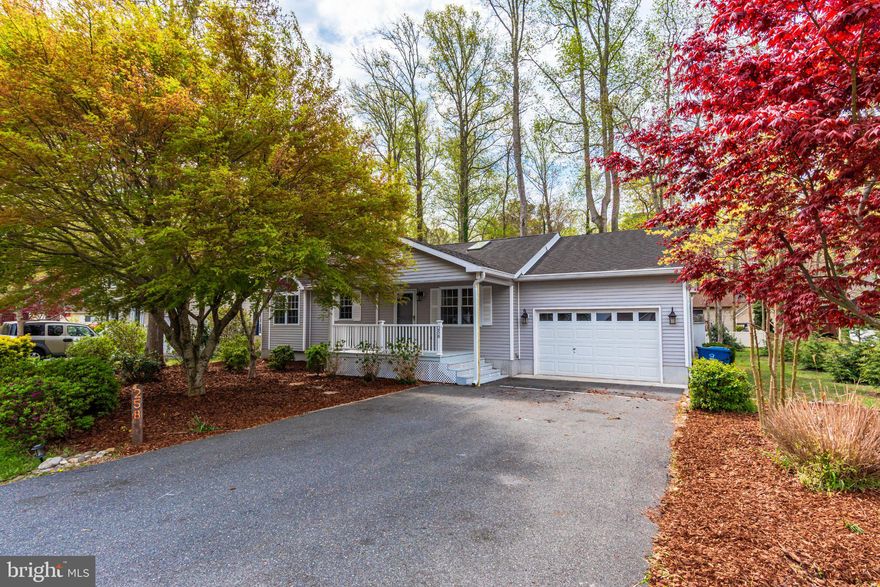 OPEN HOUSE:  Saturday, 11-1:00, April 25th, 2026.  Welcome to 258 Ocean Parkway.   Charming rancher, freshly painted, LVP floors, covered front porch, open floor plan, large living room with vaulted ceilings and skylights, primary suite with ensuite bath, 1- car garage with plenty of extra room for your car and storage, 3 season room overlooking a lovely, semi cleared backyard.  BONUS:  Encapsulated crawlspace.  Located in the popular community of Ocean Pines, Worcester County's largest community offering the most extensive amenity package that includes plenty for the outdoor enthusiast! Nature trails, bike trails, boat ramp, marina, basketball courts, tennis and pickleball club, several tot lots/playgrounds, skate park, 5 pools (1 year-round indoor, 1 oceanfront), Lake for fishing, community center, beach club with bathhouse. Ocean Pines is located off Racetrack Road (Rt. 589) offering plenty of services, including library, post office, fire dept. police dept., restaurants, grocery options and doctor's offices! JUST 8.9 miles to the beach! Better act FAST! This one won't last!