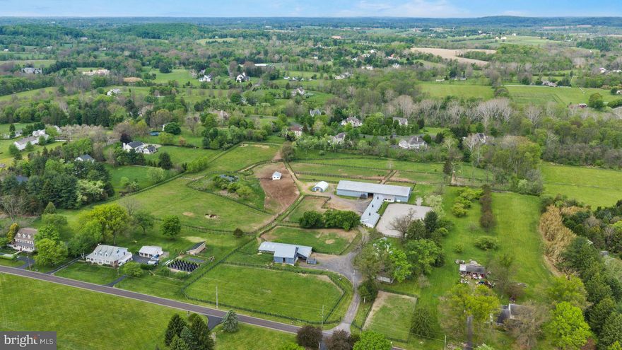 An incredible opportunity for nearly 20 acres in Upper Makefield, Twp ideal for the horse enthusiast or person looking to build their quintessential dream Bucks County estate.  Depending on your vision, the 1810 farmhouse would be the perfect residence if keeping the property as an equestrian operation, and it would make a great guest cottage for someone looking to build their own main house.  The stone barn, equipped with 16 spacious stalls, is absolutely gorgeous with tons of natural light.  It leads out immediately to the rolling pasture for easy turnout.  If 16 stalls is not enough, there is another 16 stalled stable that is attached to the indoor & outdoor riding arena, again with spacious stalls.  The long distance views are pretty amazing, to fully appreciate them, they really need to be experienced in person.  The property is not under any type of conservation - subdivision may be possible (buyer to verify).