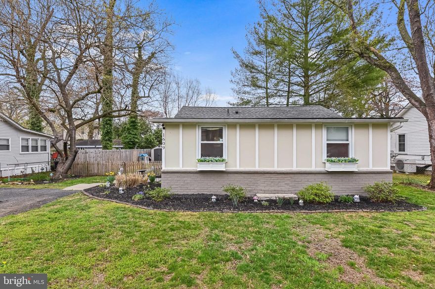 Don’t miss this beautifully renovated gem in the highly sought-after waterfront community of Woodland Beach! This move-in ready home perfectly blends modern updates with timeless charm. Step inside to find stunning luxury vinyl plank flooring flowing throughout the main living areas. The kitchen is a chef’s dream—featuring crisp white shaker cabinets, gleaming granite countertops, stylish backsplash, and stainless steel appliances. An inviting eat-in area, adorned with elegant wainscoting, offers plenty of space for family meals or entertaining. The kitchen opens seamlessly to a spacious family room, perfect for gathering and relaxation. Just off the family room is a convenient laundry room, thoughtfully located for everyday ease.
The main-level primary suite is a true retreat, complete with a private, upgraded en-suite bathroom. Two additional bedrooms and a beautifully updated guest bathroom complete the interior. Enjoy outdoor living at its finest with a generous deck and patio—ideal for entertaining guests or unwinding after a long day. Woodland Beach offers an incredible lifestyle with access to multiple beaches, marinas, and scenic community spaces. All this, just minutes from shopping, dining, and major commuter routes to Washington D.C., Northern Virginia, Baltimore, and Annapolis. Schedule your tour today and fall in love with this wonderful home and vibrant community!