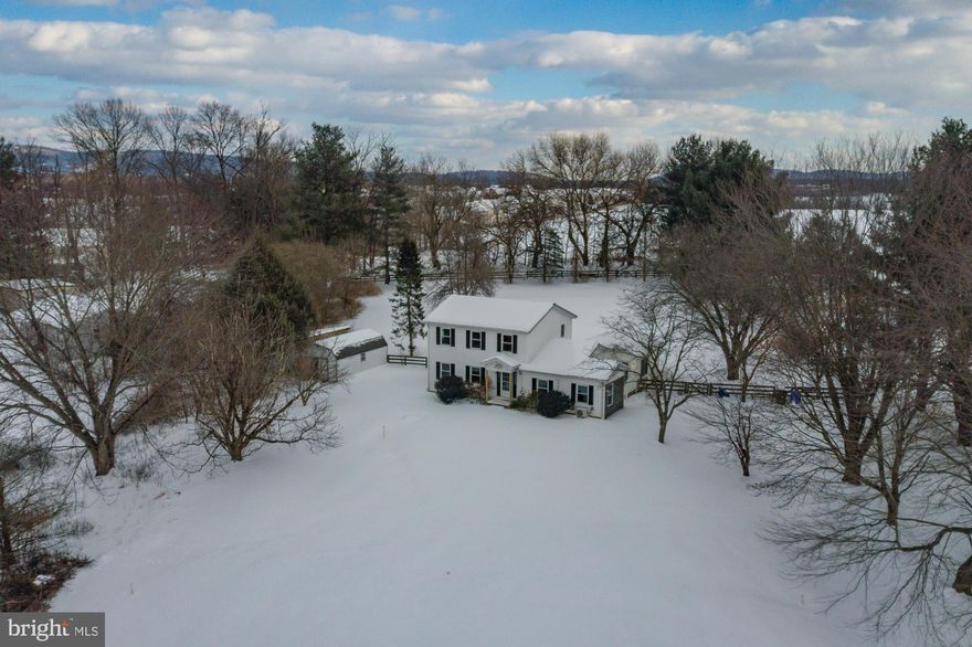 **FHA assumable loan available @2.99%** Now is YOUR chance to own a beautiful piece of property on 2.5 acres in charming Knoxville. This beautiful colonial has just undergone several updates to get it ready for the market. Situated on a slight knoll with beautiful views of open land, mature trees in every direction, including weeping willows and fruit trees. Perfect for the micro farmer, baker and chef who wants to have their own chickens, bees and vegetable garden. A spring fed stream runs through the front of the property as you drive up the long treelined driveway to the house. 
**Formal living room and dining room with hardwood floors, Charming country kitchen with new LVP flooring opens up the family room. **There have been two additions made to this property since initial construction:  a four-season sun room that was added in 2007 with French doors, the garage was converted into a main level bedroom in 2021.  **Upstairs, all the carpets were just replaced. The owner suite has a private en-suite bath, and there are two additional bedrooms with shared hall bath. All three bathrooms have just undergone complete renovations, including new vanities, lights, commodes and new glazed tile surrounds and tubs. **The large basement with direct access to backyard has possibility for more finished square footage. Bring your ideas to life! **NEW SEPTIC FIELD IN DEC 2020, NEW WELL PUMP IN 2021, NEW HVAC FOR THE MAIN HOUSE, AND BRAND NEW HVAC FOR THE NEW ADDITION IN 2025!!! WELL WATER QUALITY TEST PERFORMED IN FEB 2025. **Brunswick/Knoxville is a wonderful place to live. Close to the MARC train and highways for easy commuting, yet you're in a completely quiet rural setting. Close to bakeries, restaurants and grocery store and shops. Othello Recreation Park is gorgeous addition to the community, full of ballparks and recreational opportunities. Enjoy walking or biking along the C&O Canal and Towpath. Harpers Ferry National Park is just a few minutes away, as are several wineries. Don't miss your chance to own this special piece of property!